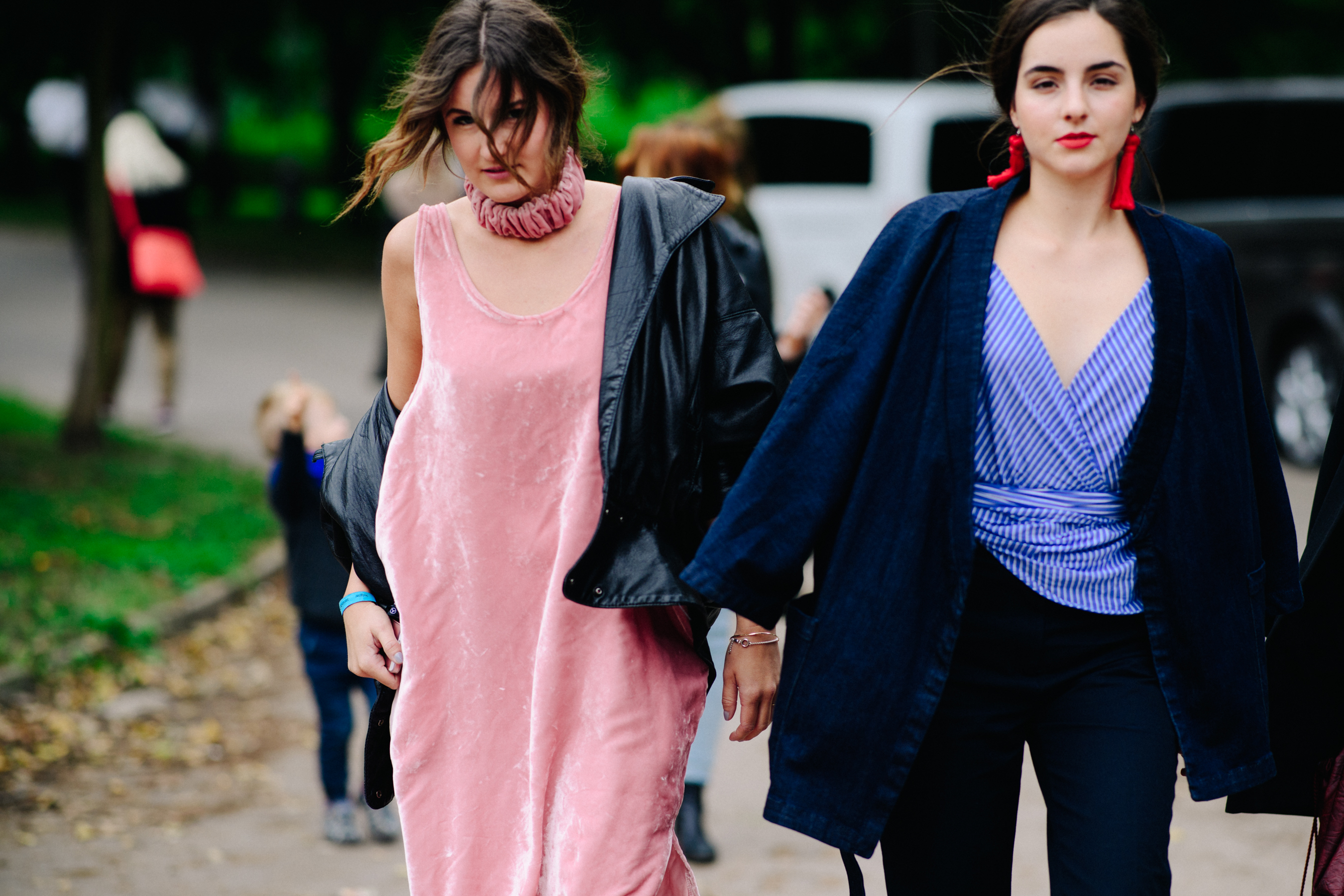 Two women wearing pink and blue