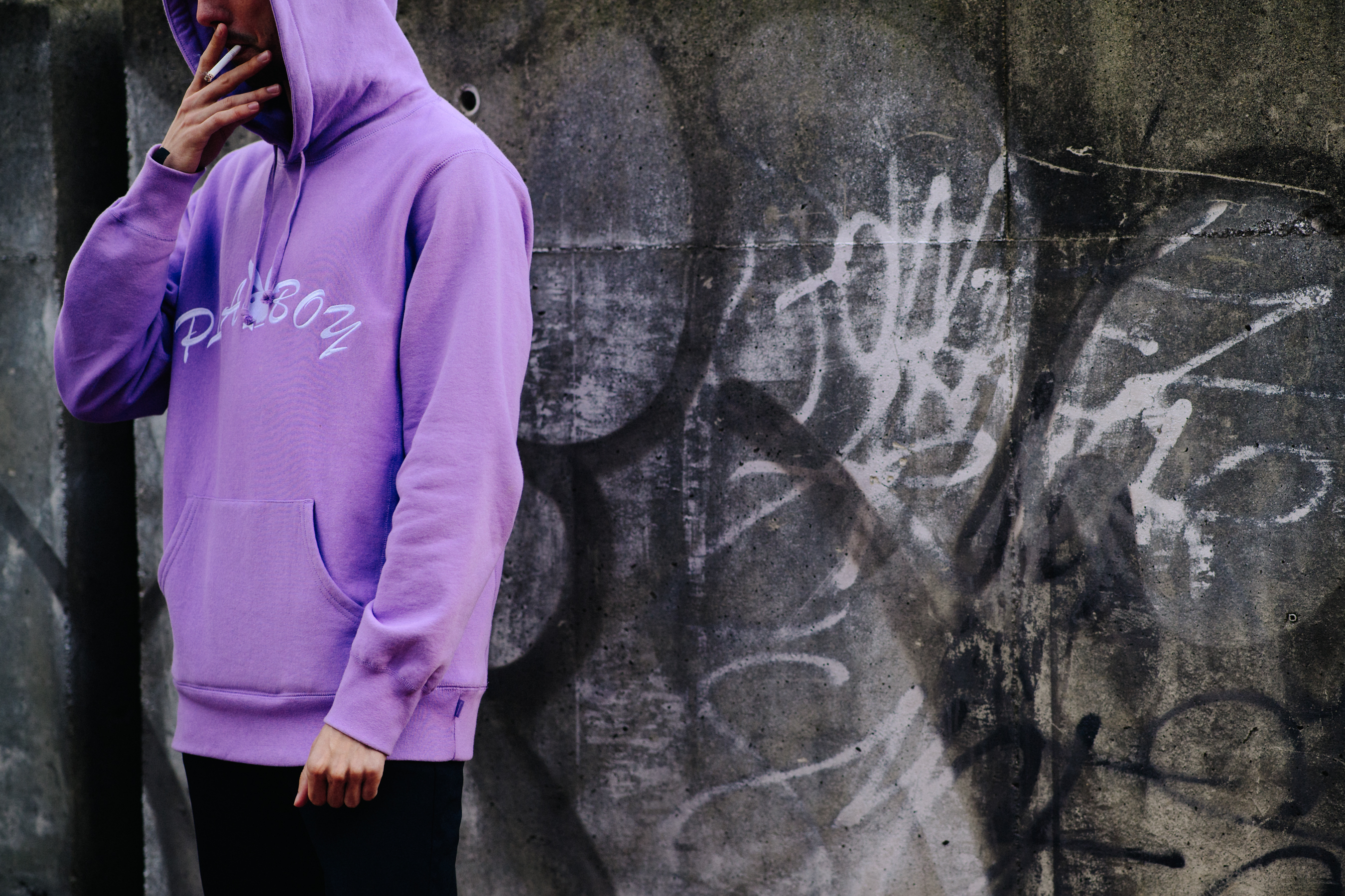 Woman wearing purple hoodie