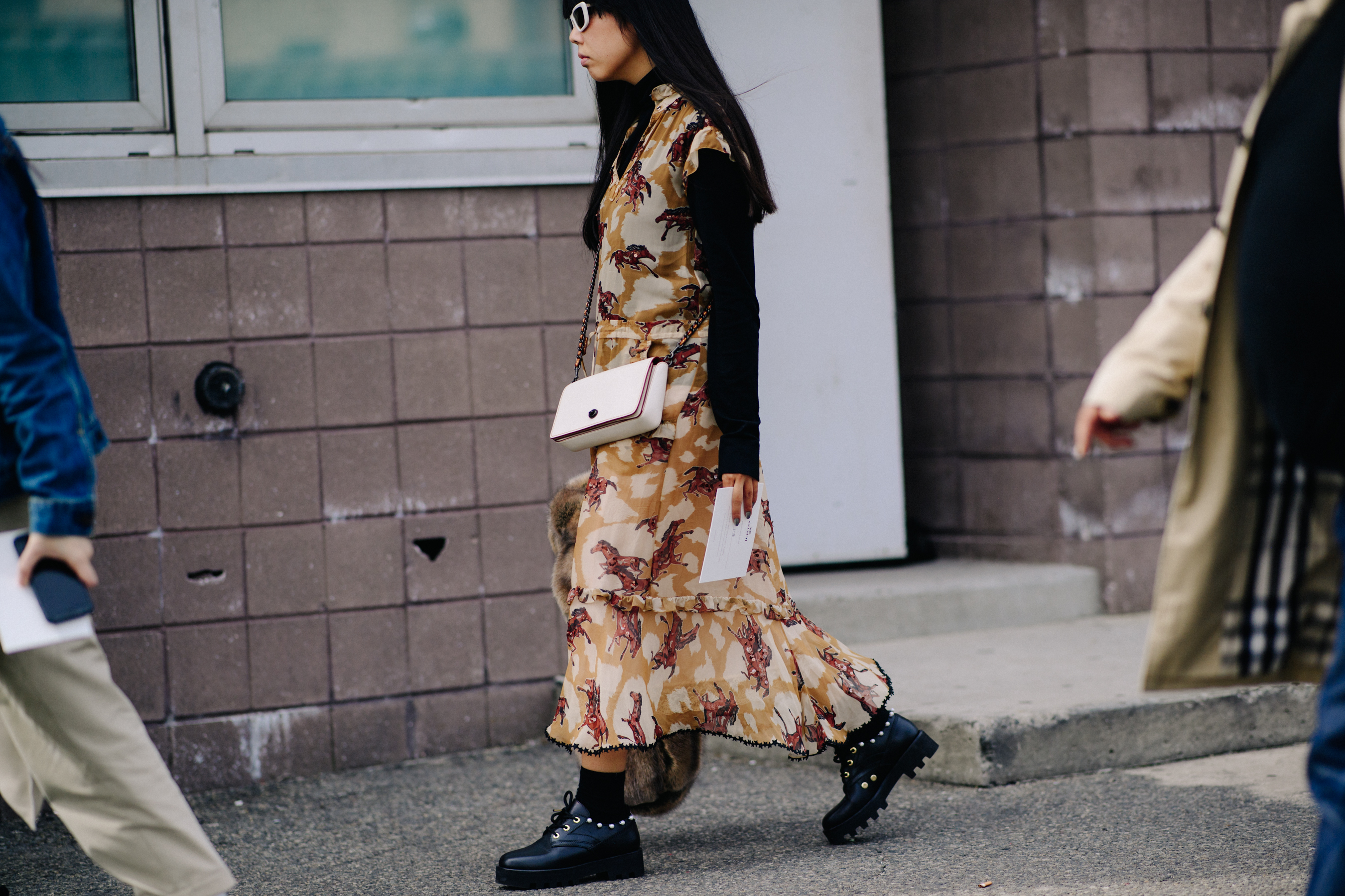 British journalist wearing long dress