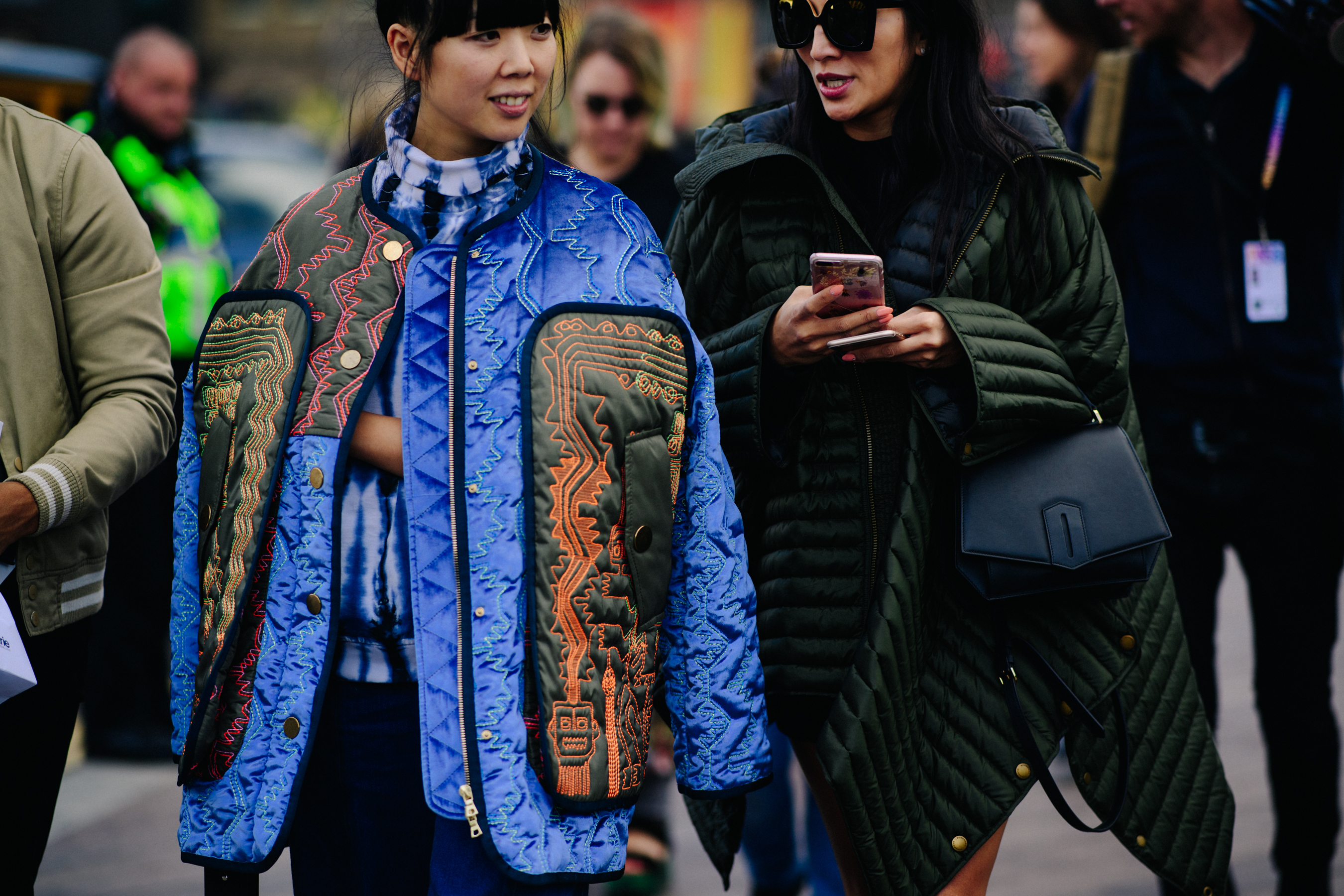 Two women wearing cool jackets