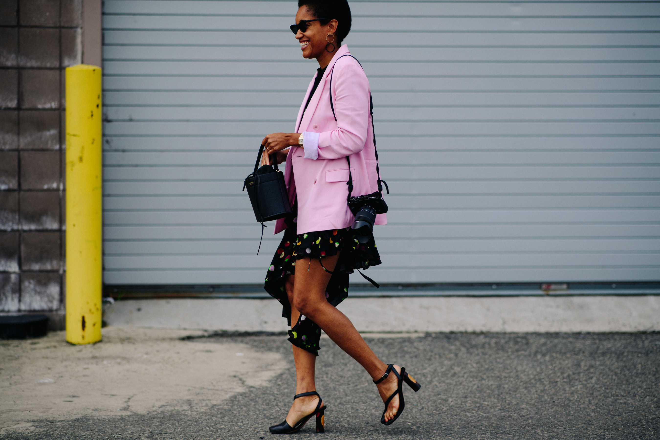 Photographer wearing pink blazer