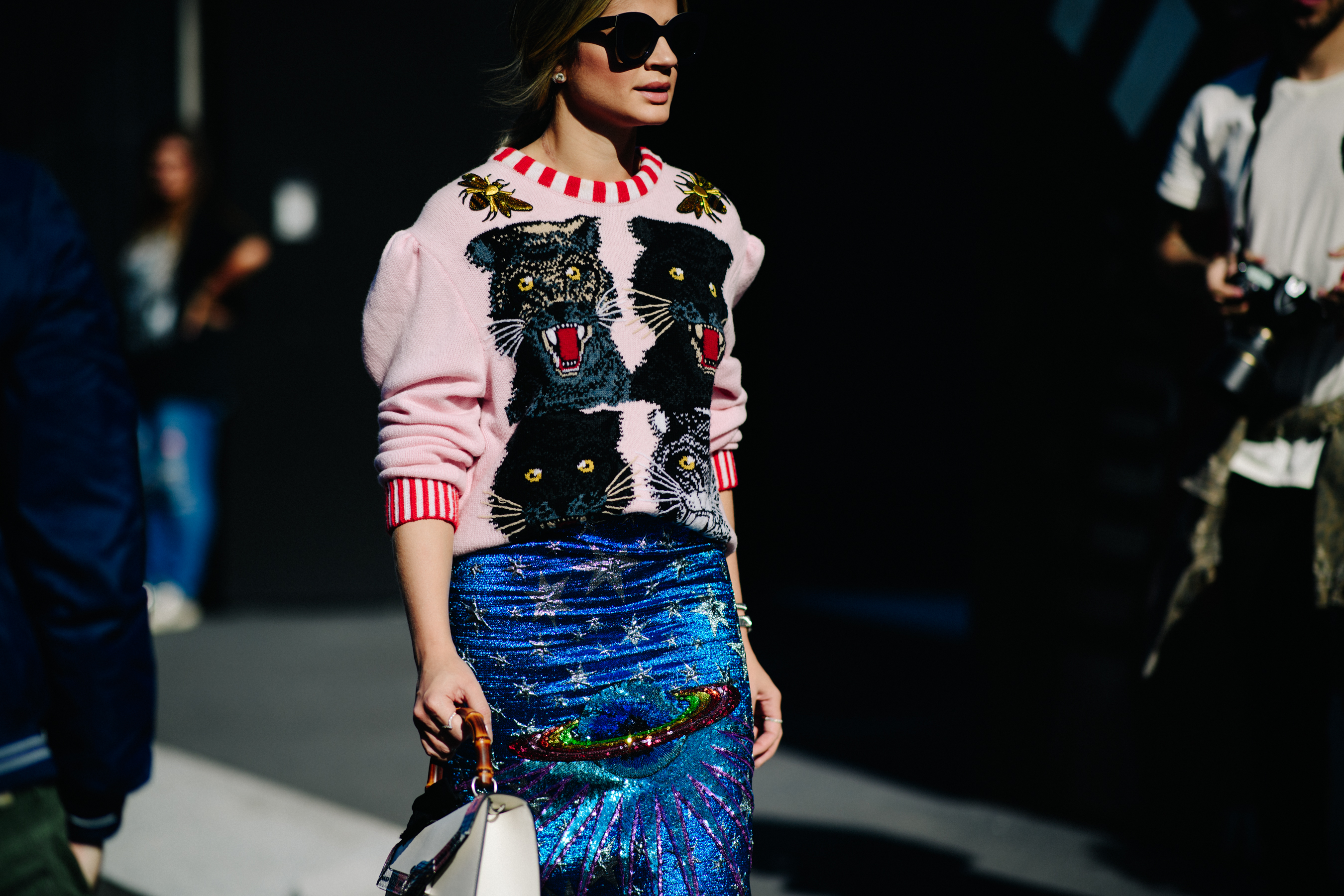 Woman wearing animal head print jumper