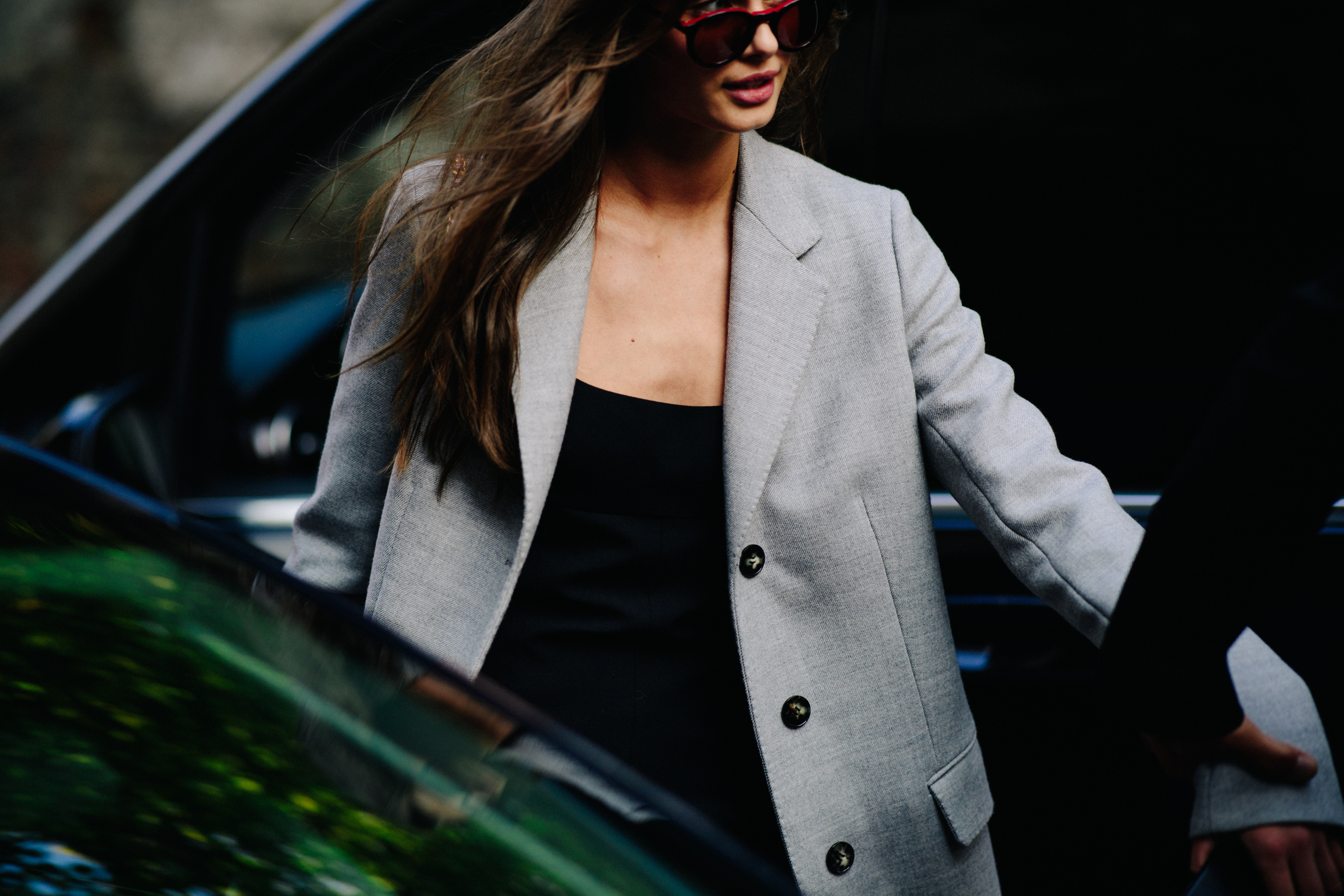 American model wearing grey jacket