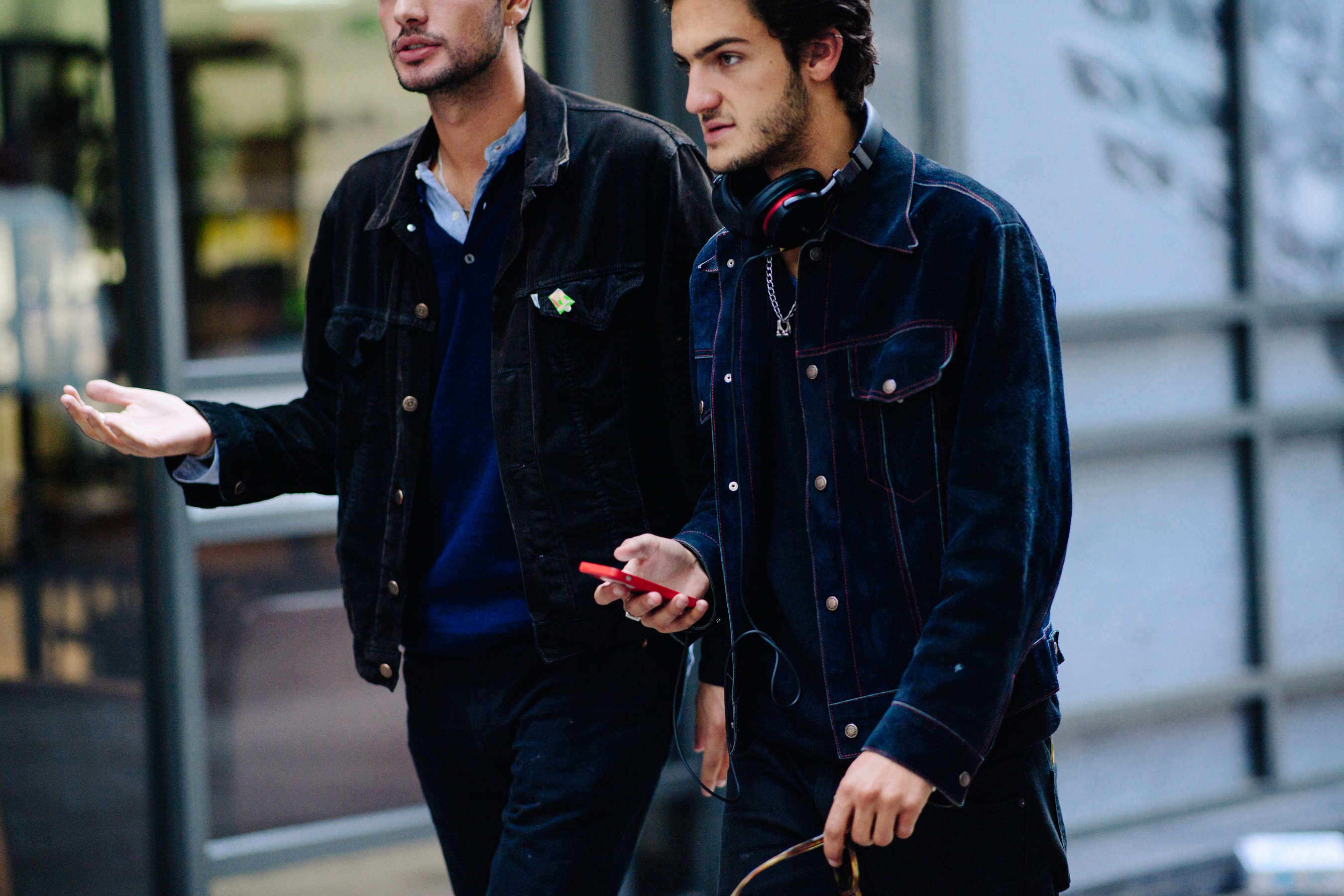 Two men wearing dark denim