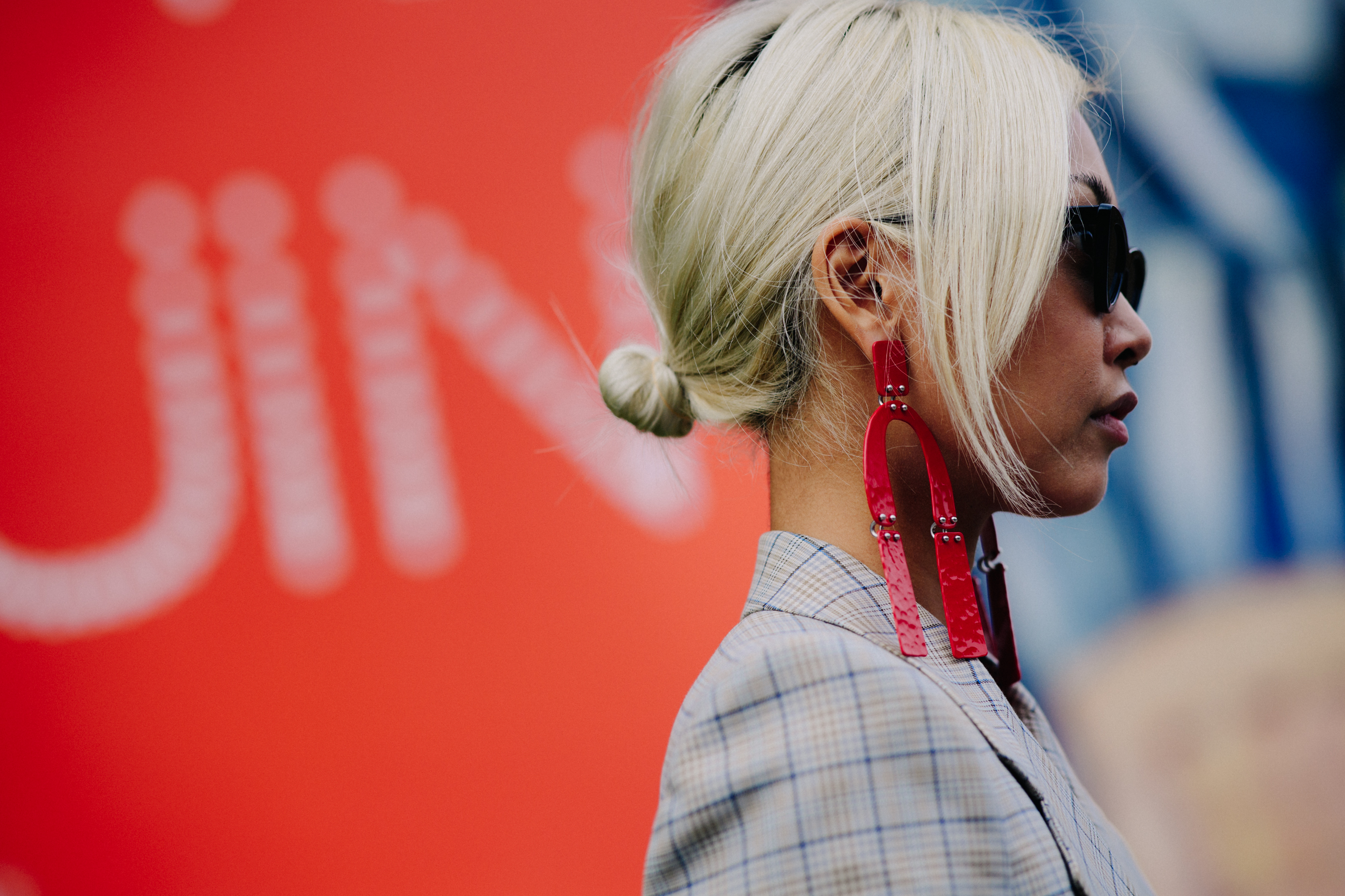 Blogger wearing long red earrings