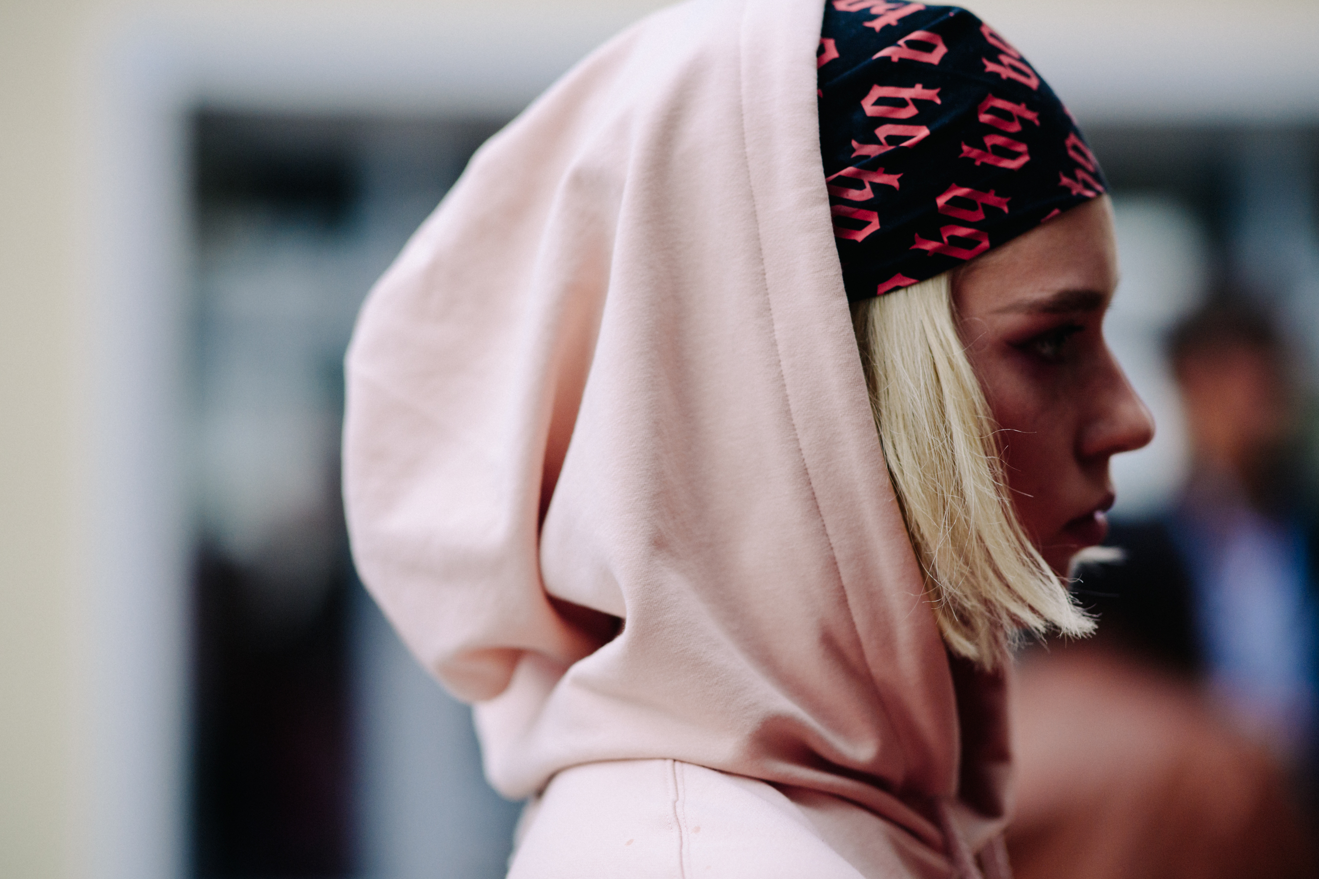 Girl wearing pink hoodie and head band