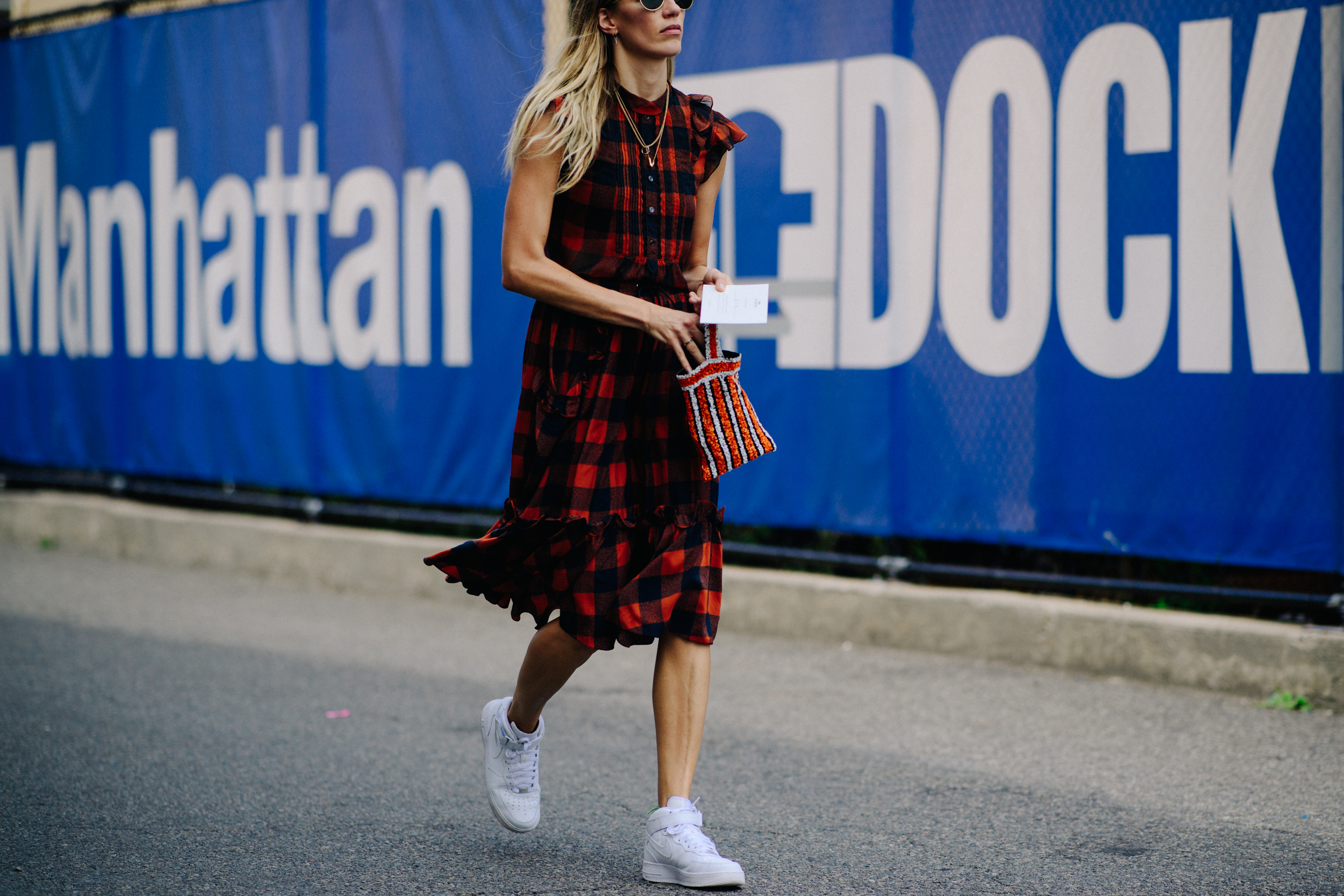 German buyer wearing dress with sneakers