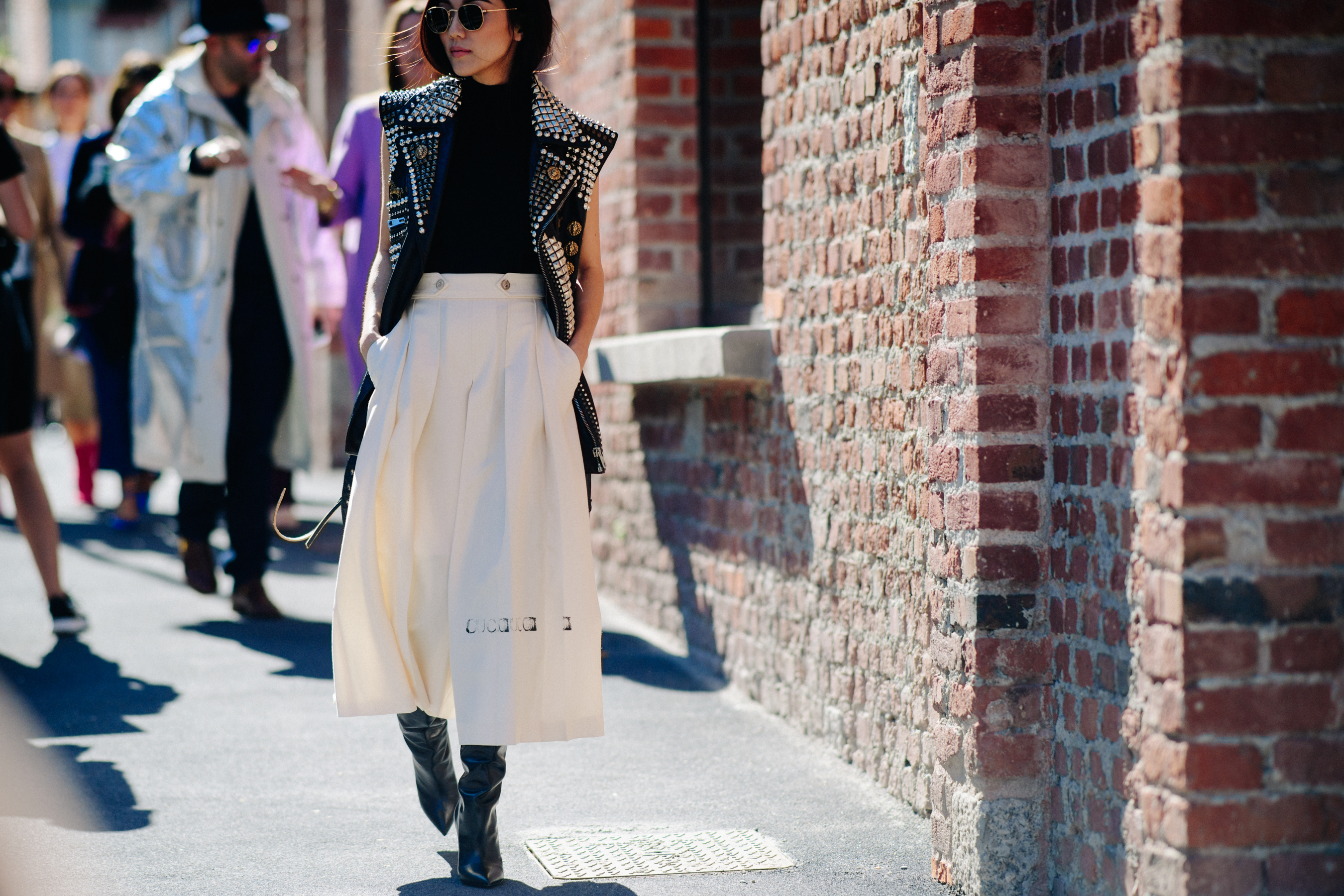 Asian blogger wearing studded sleeveless jacket