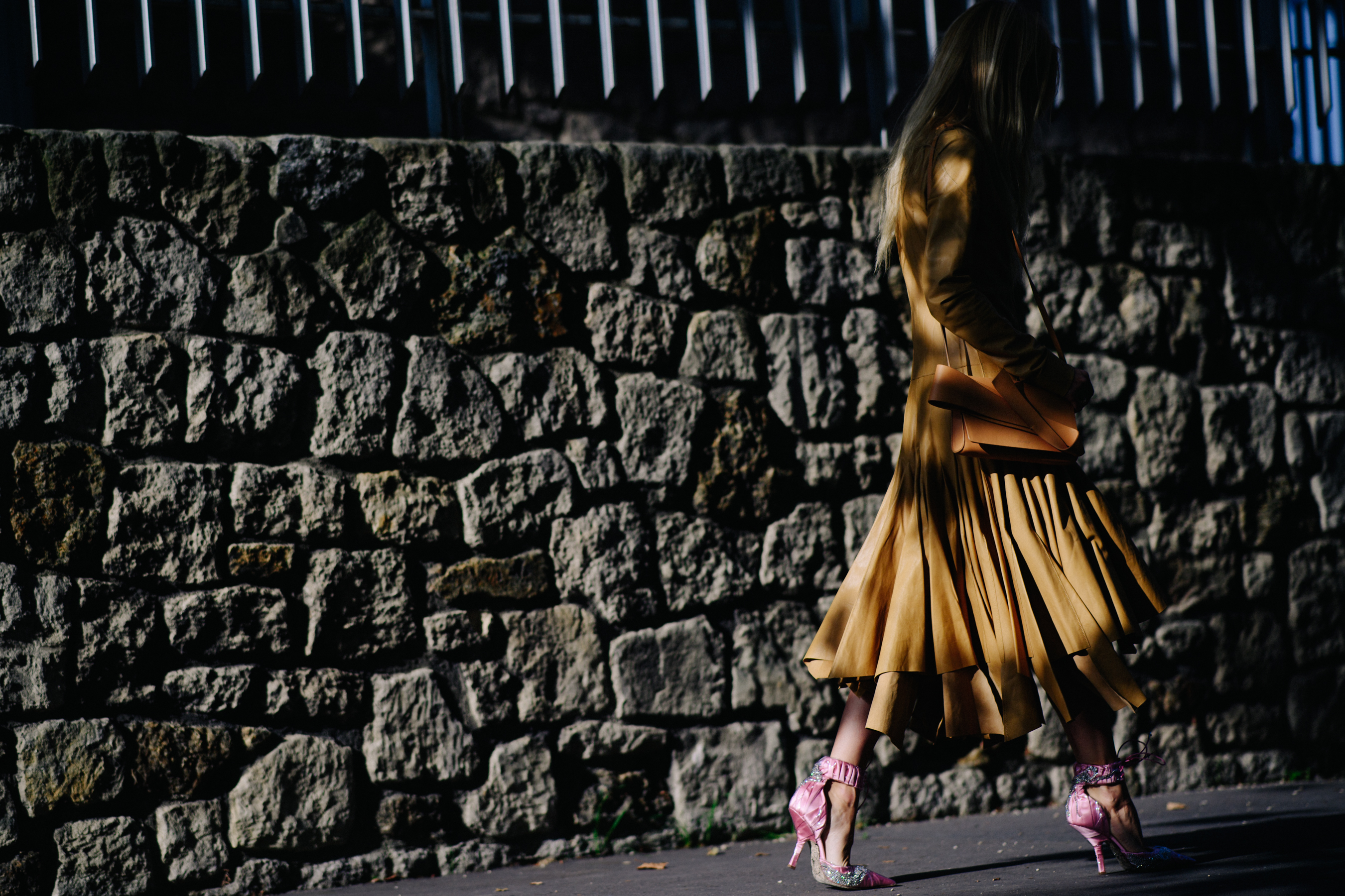 Italian designer wearing brown dress