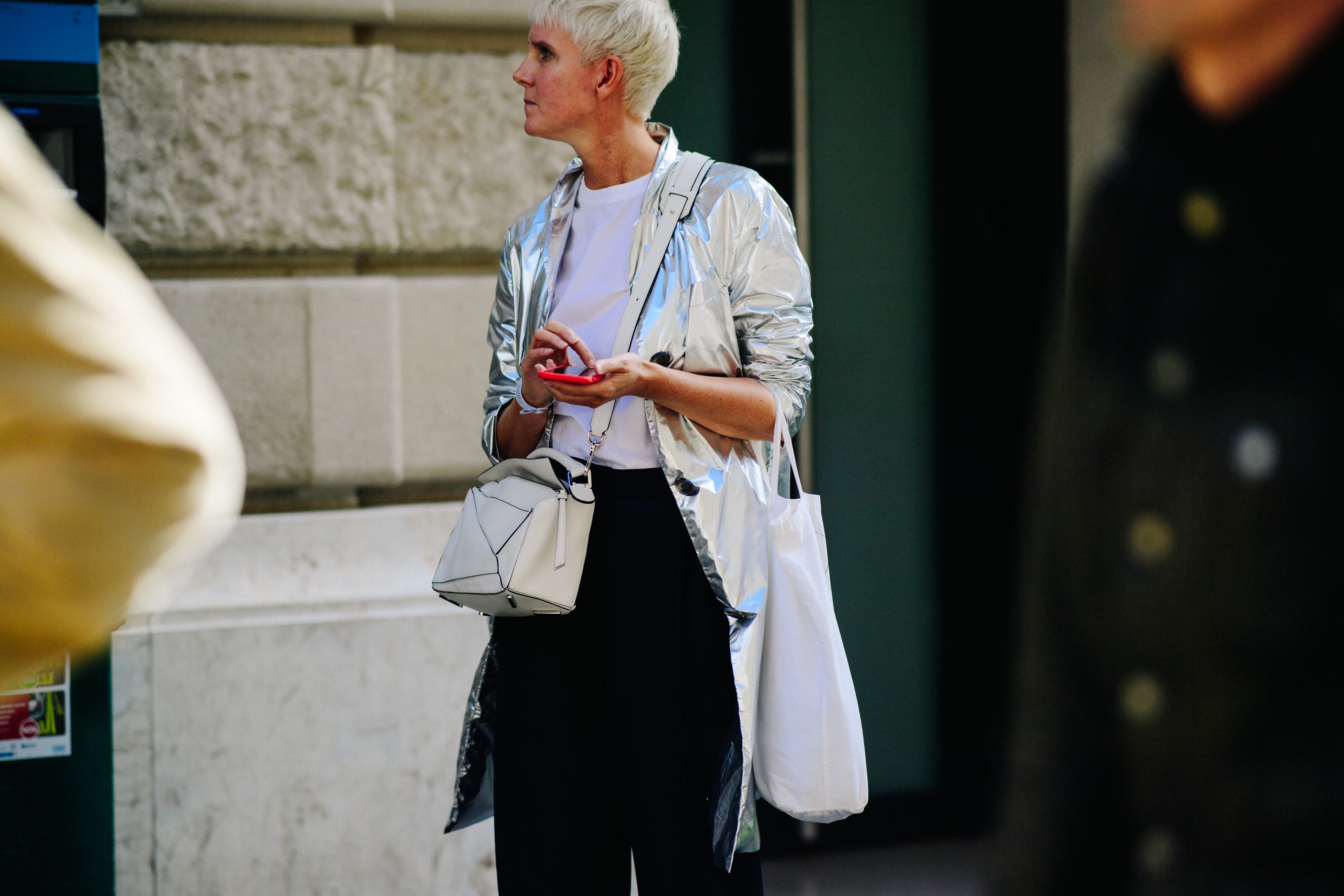 Woman wearing silver coat