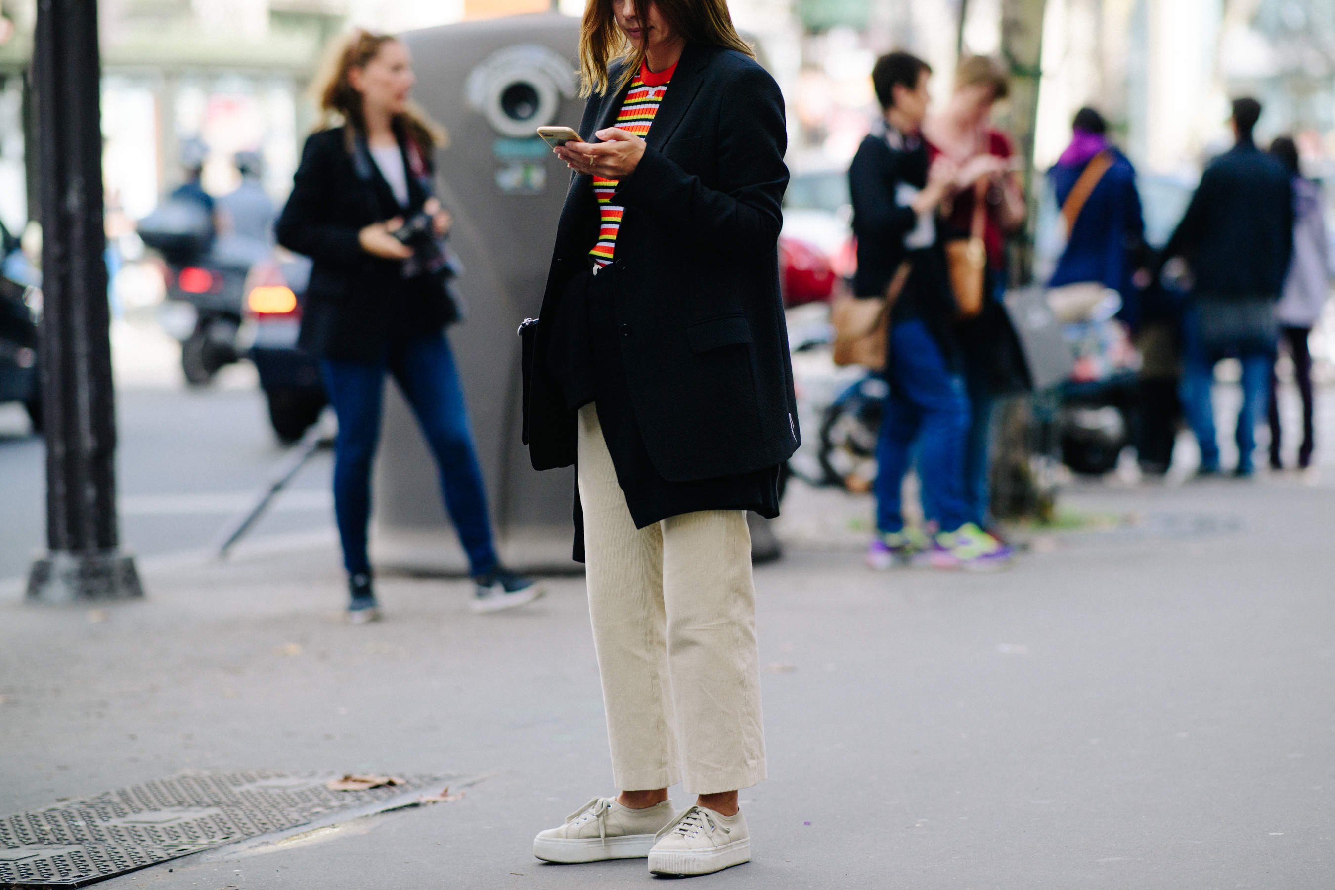 Woman wearing white pants