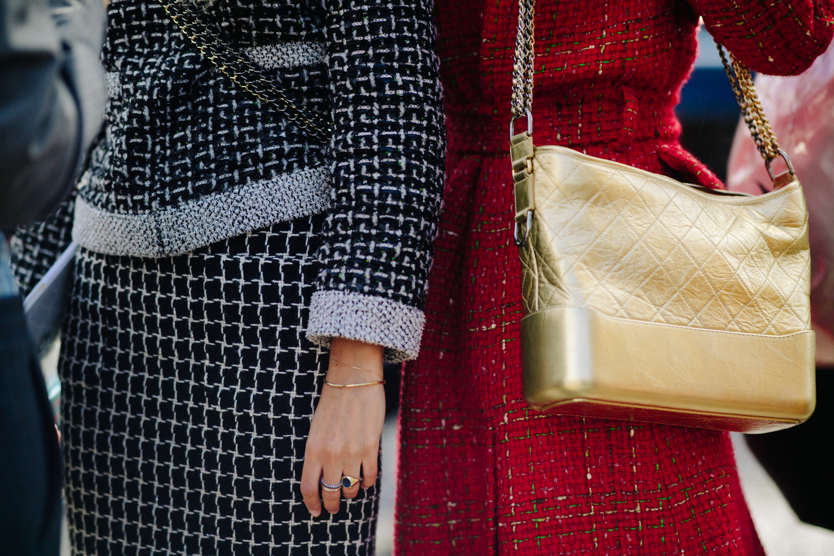 Two womenw earing Chanel outfits