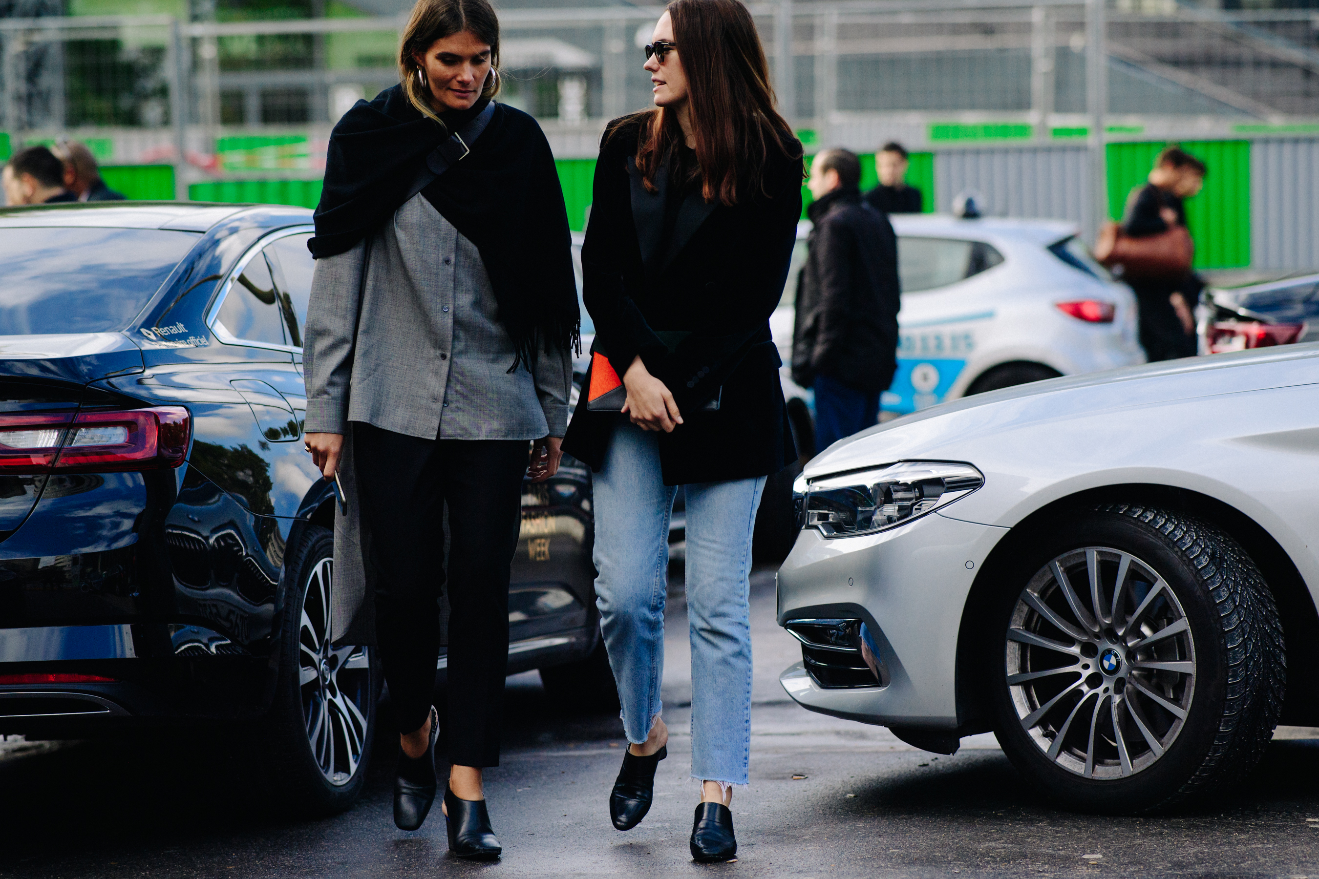 Two women wearing dark clothes