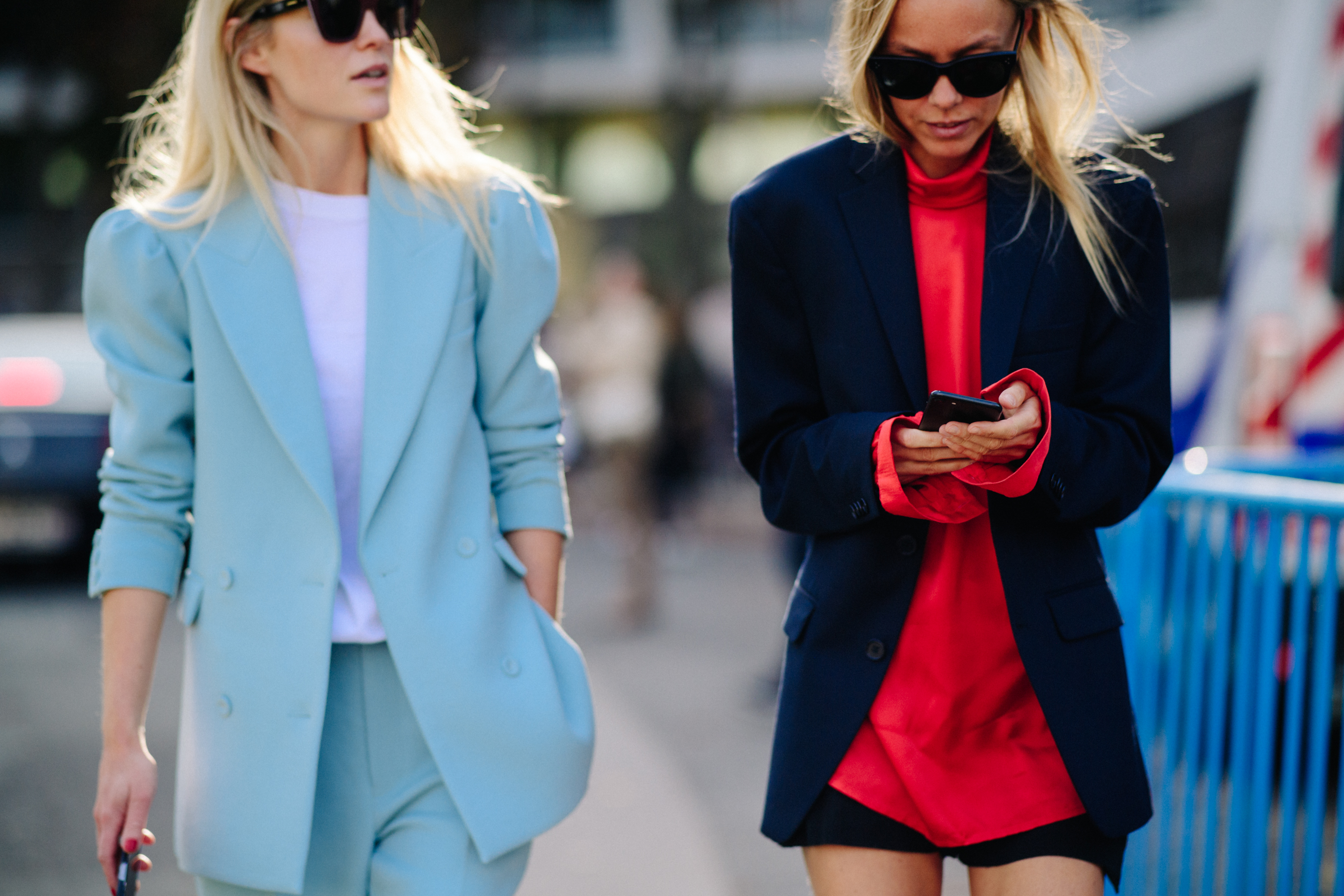 Two designers wearing blue and red