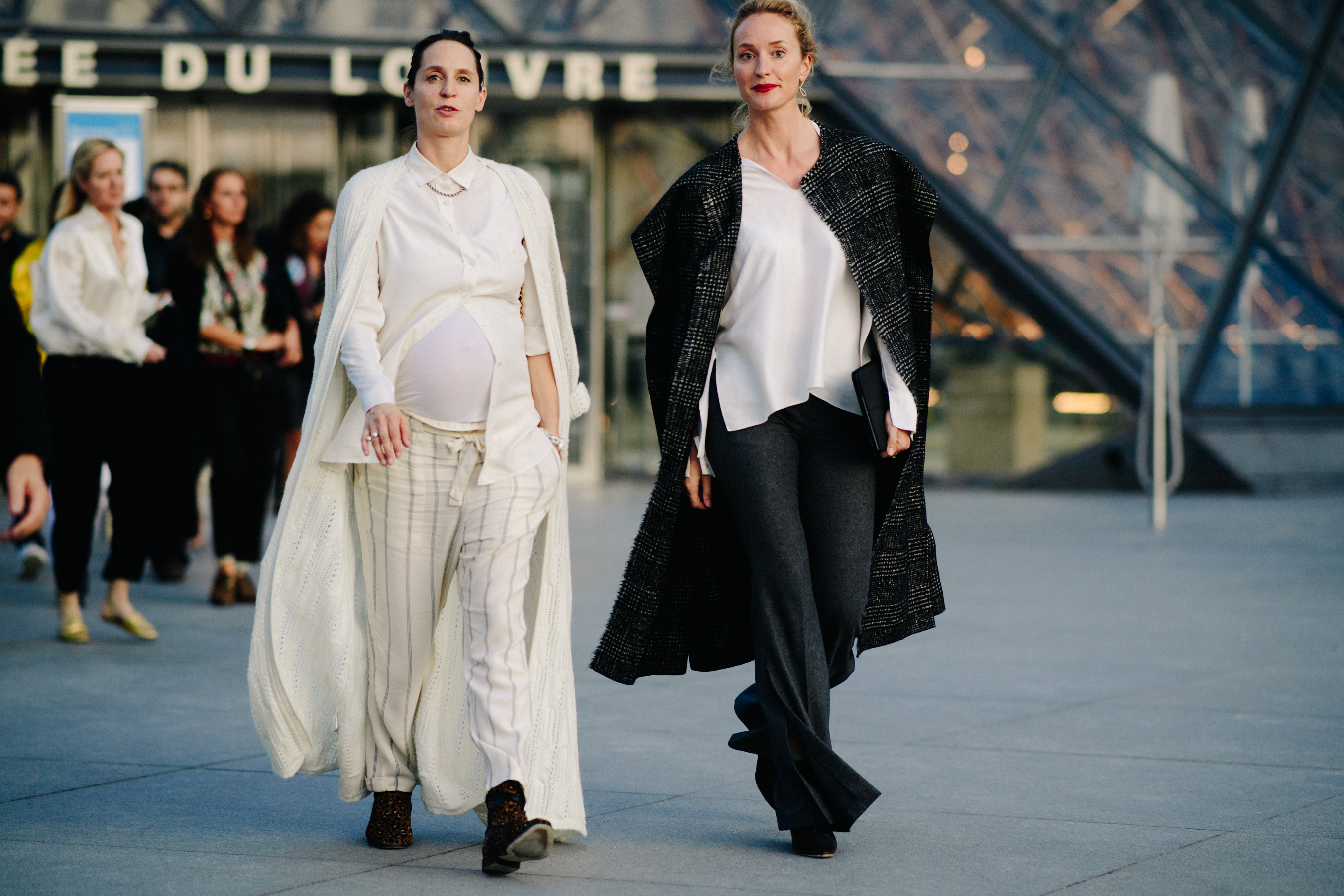 Two women wearing black and white