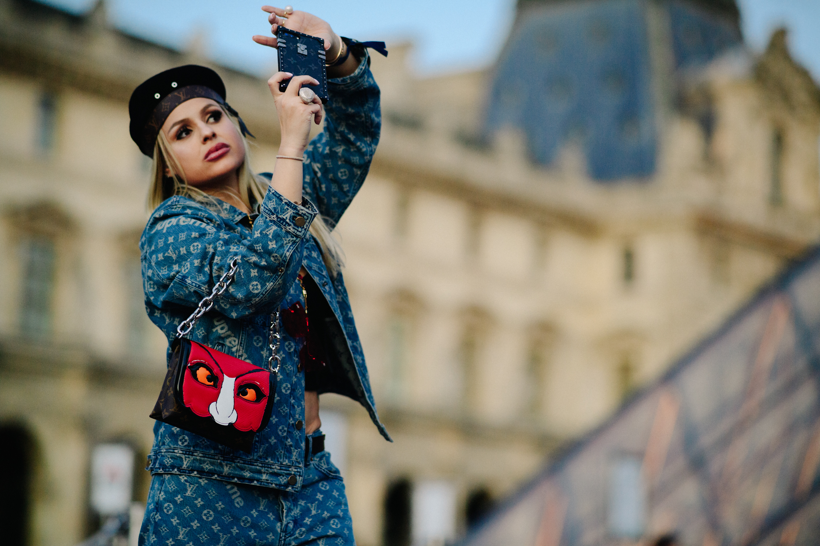 Woman wearing Louis Vuitton x Supreme
