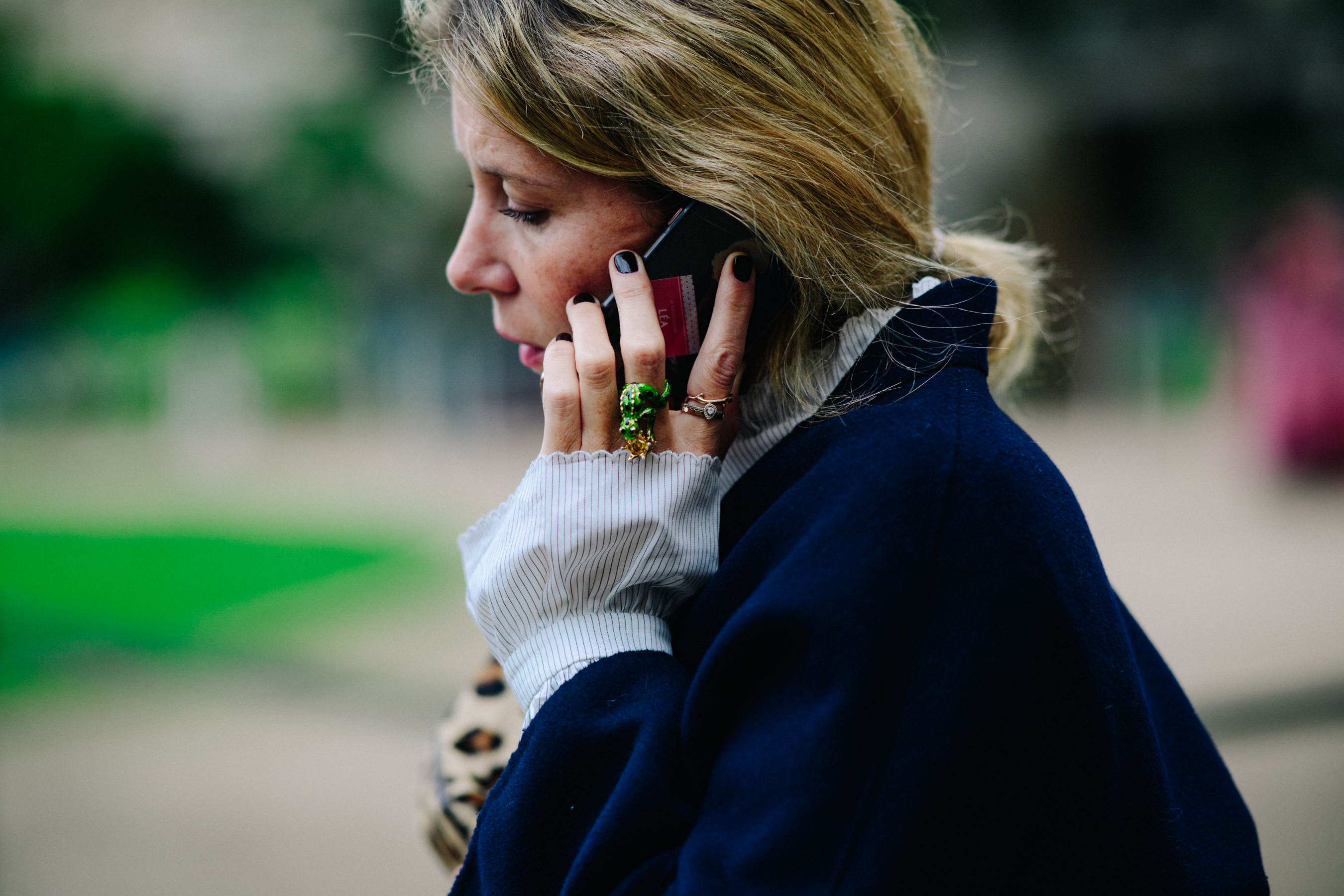 Woman wearing rings and a shirt