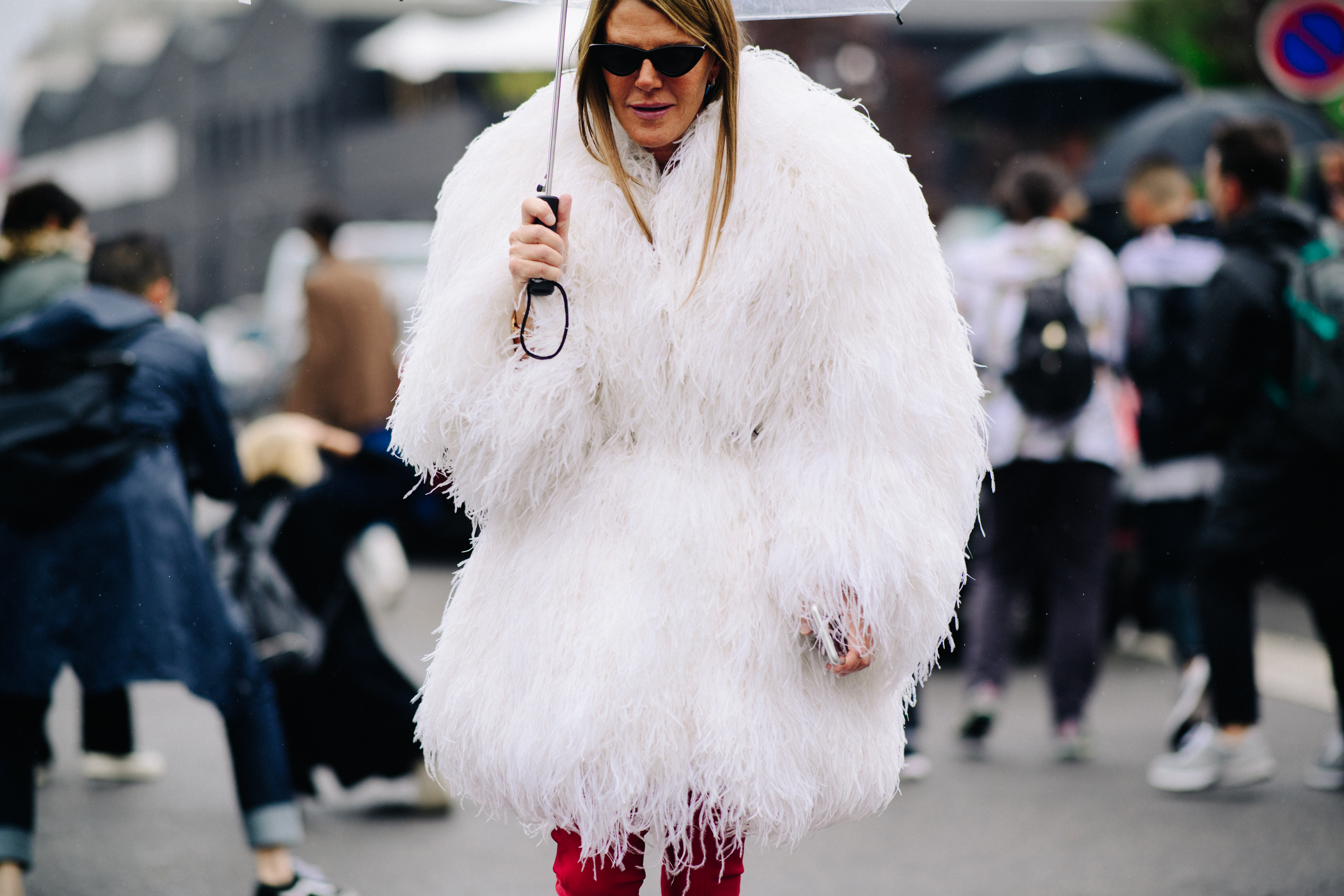 Italian stylist wearing white lama coat