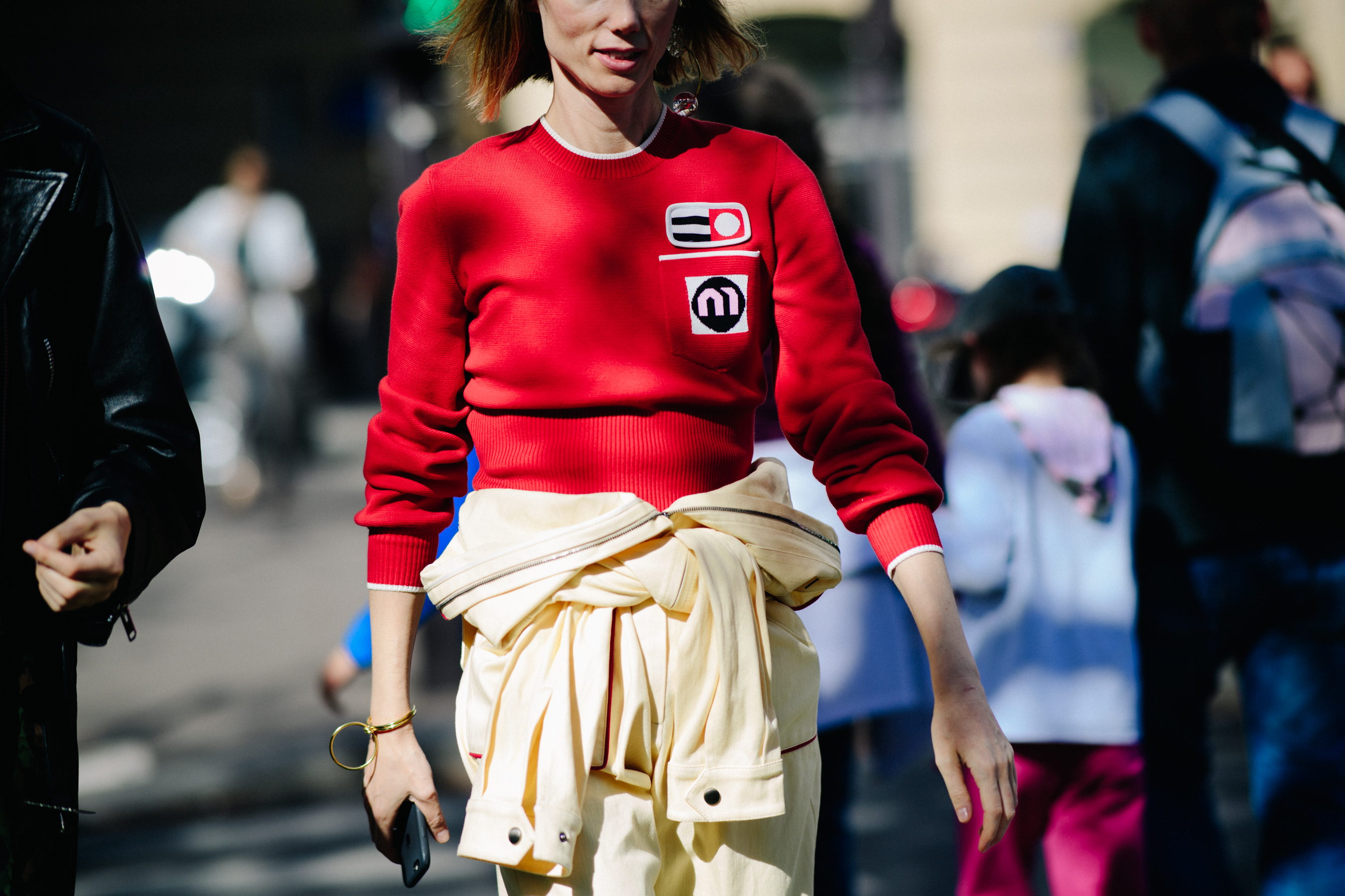 Russian styist wearing red sweater