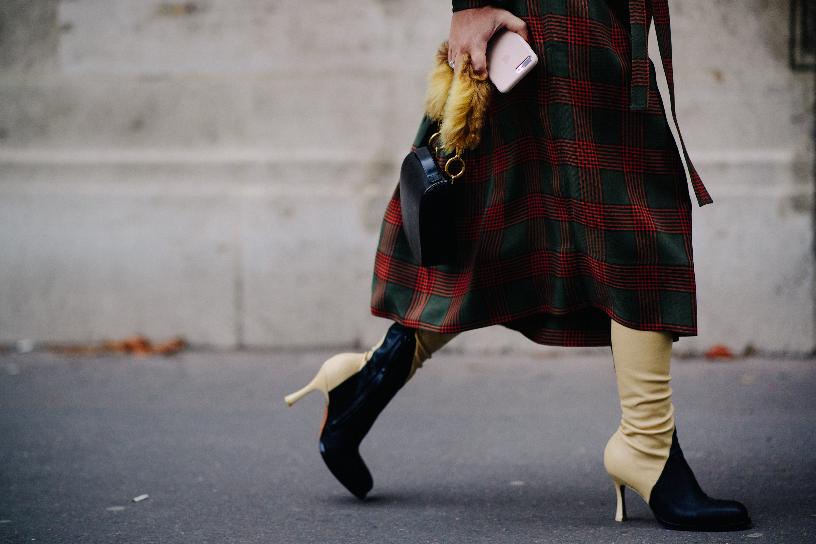 Woman wearing black and beige boots
