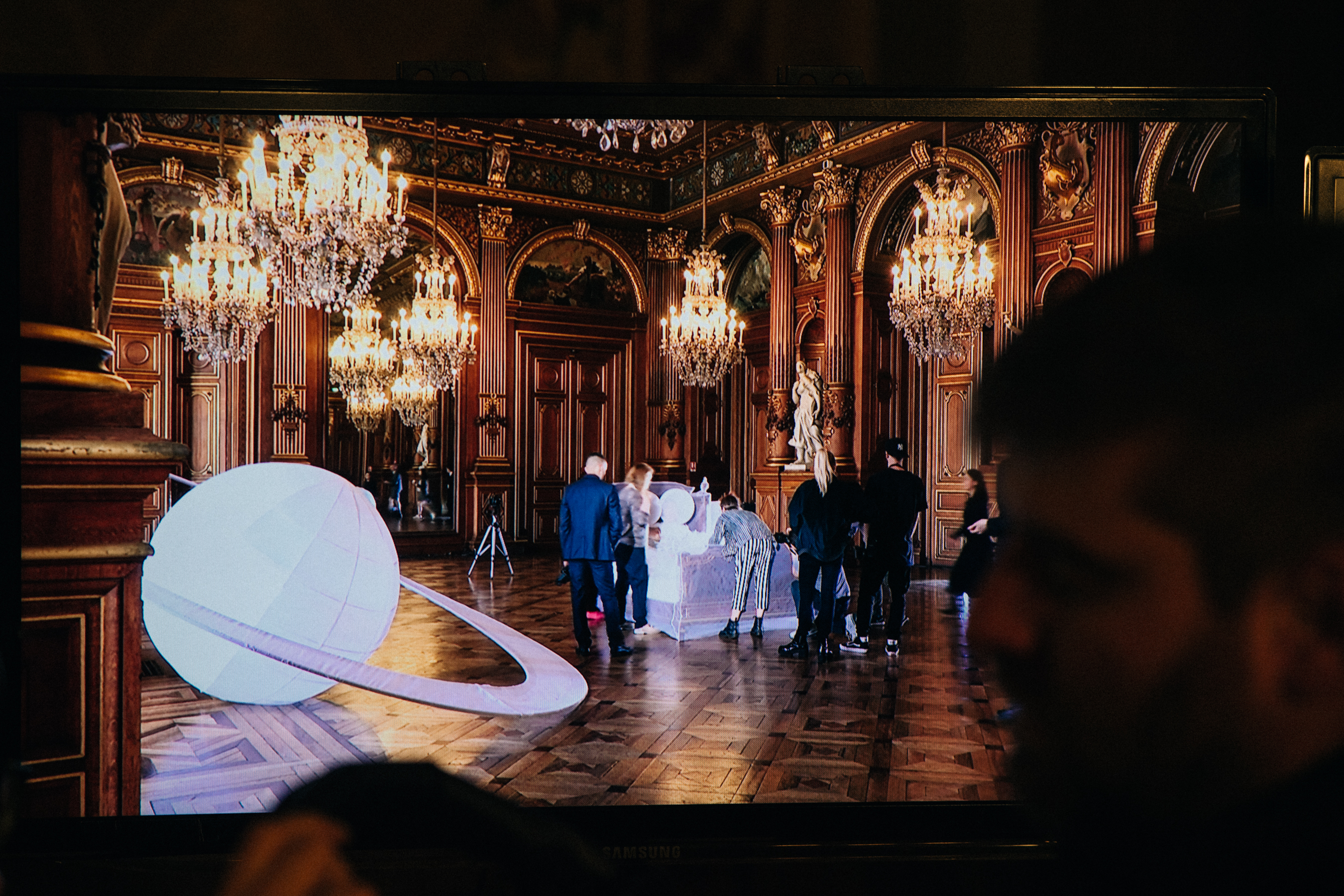 Monitor with models before a show