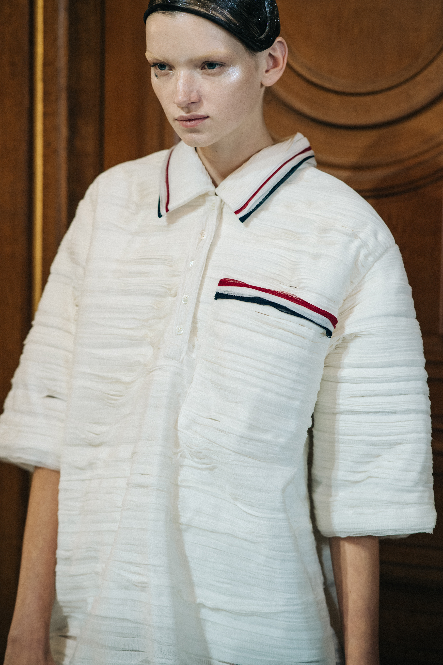 Model wearing white suit