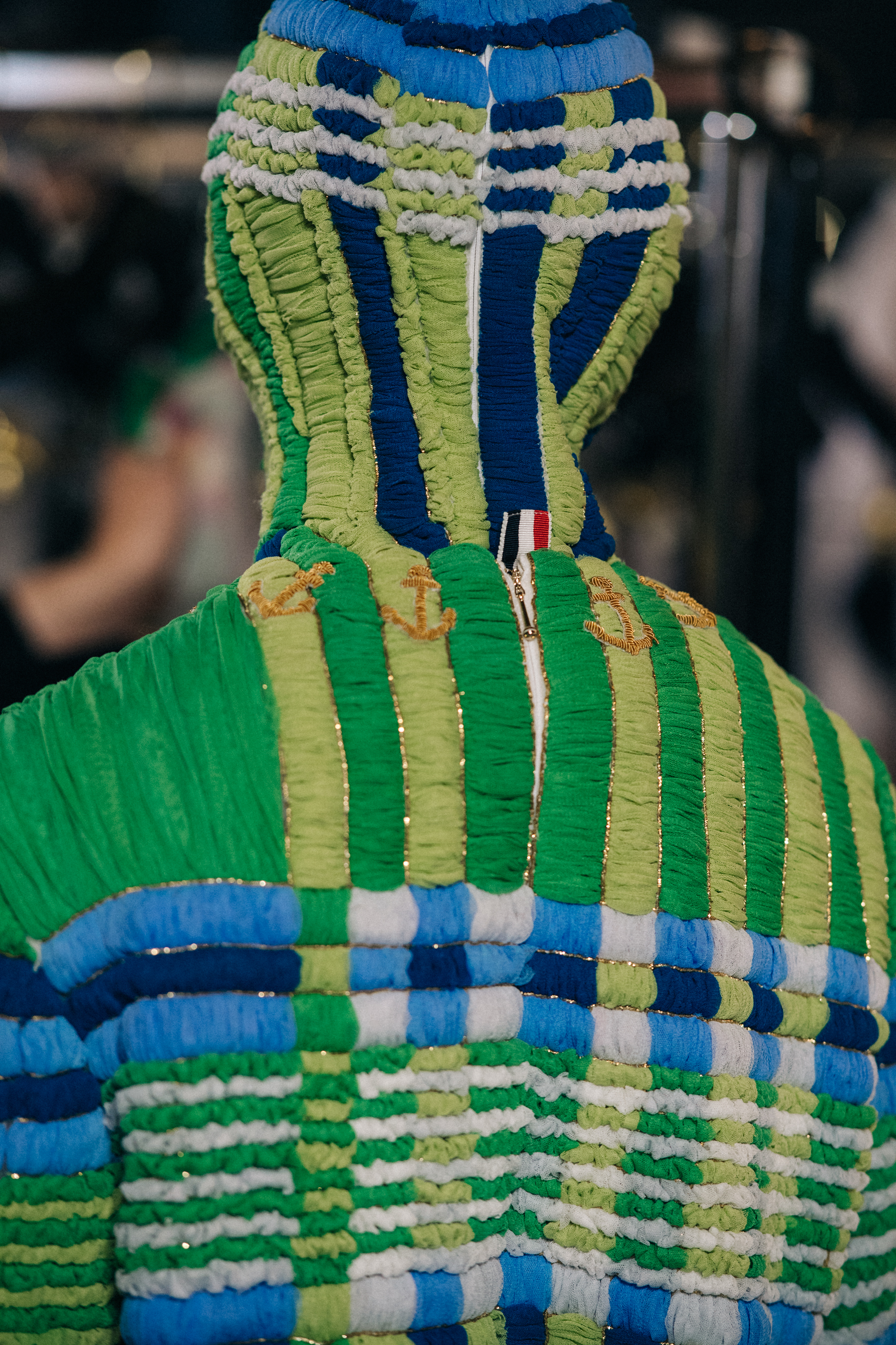 Models wearing colourful reconstructed suits