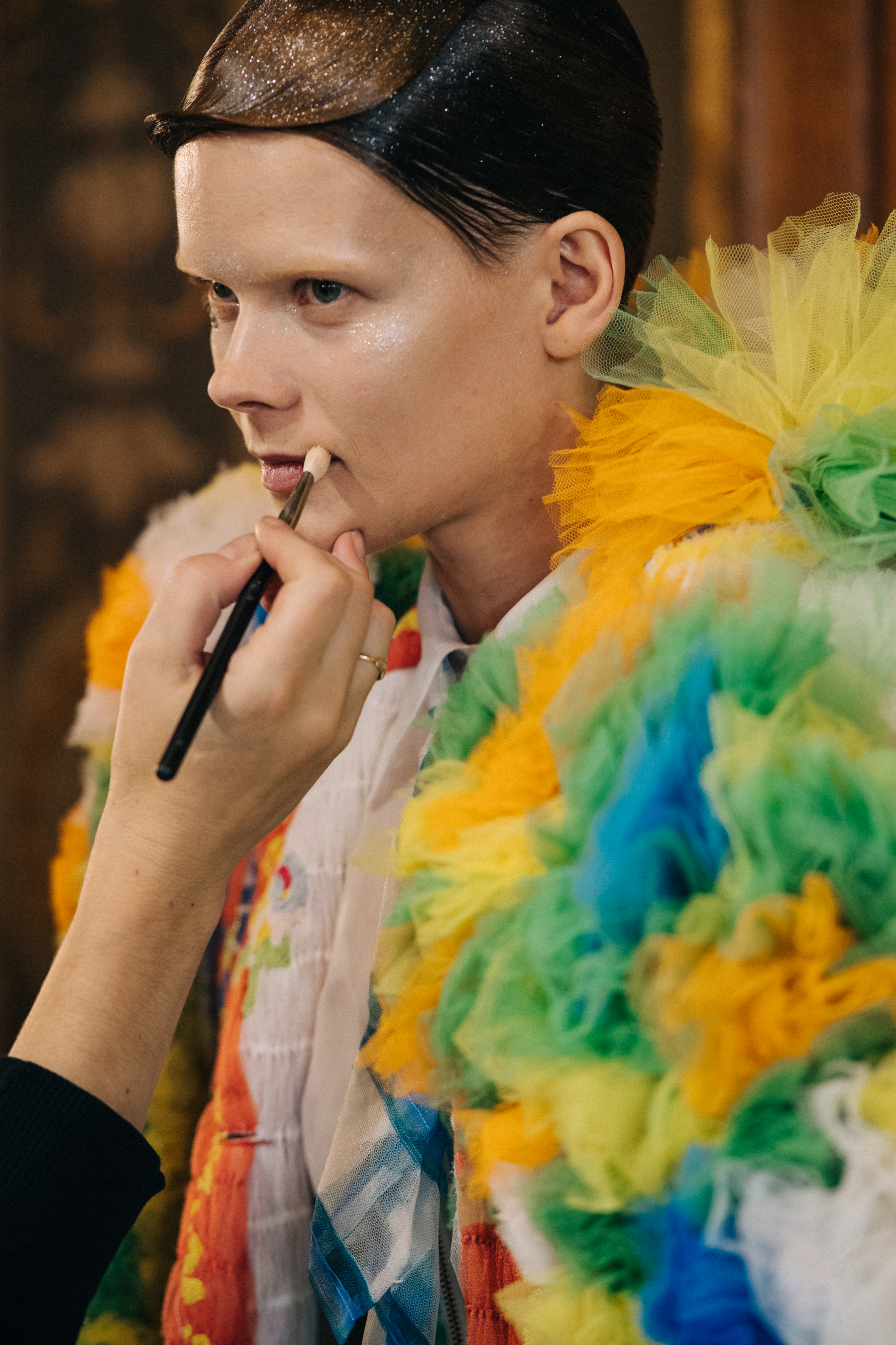 Models wearing colourful reconstructed suits