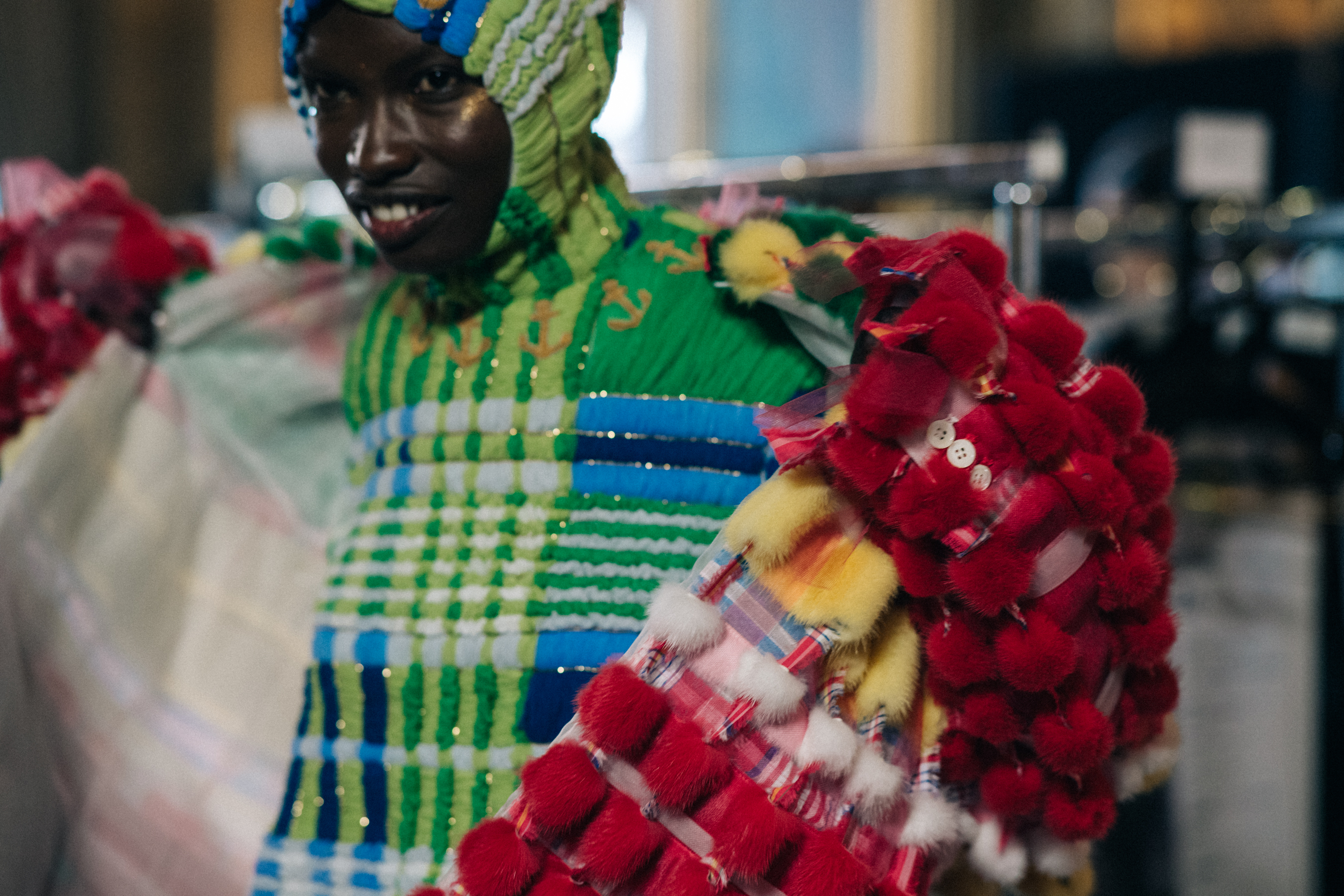 Models wearing colourful reconstructed suits