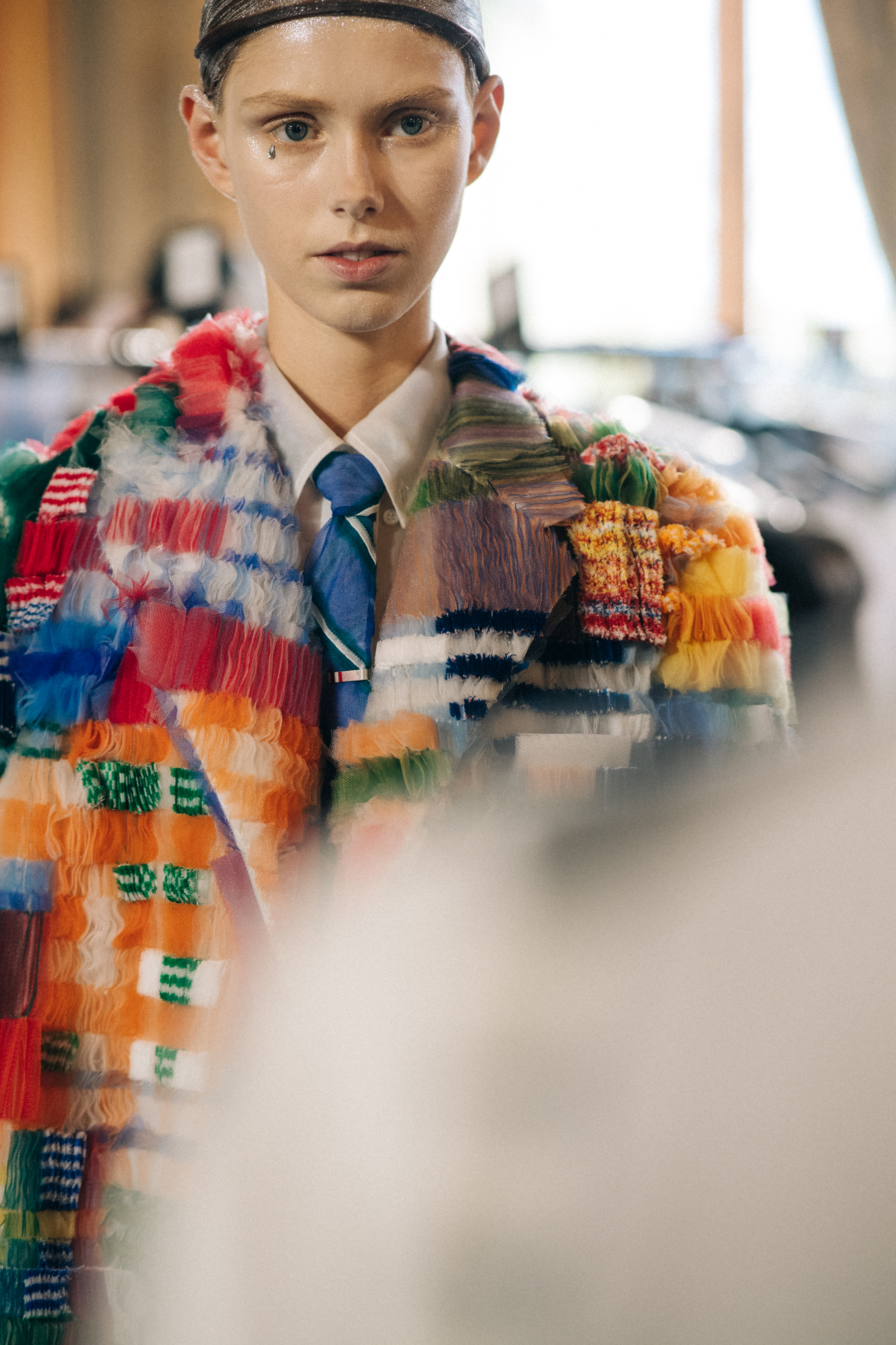 Models wearing colourful reconstructed suits