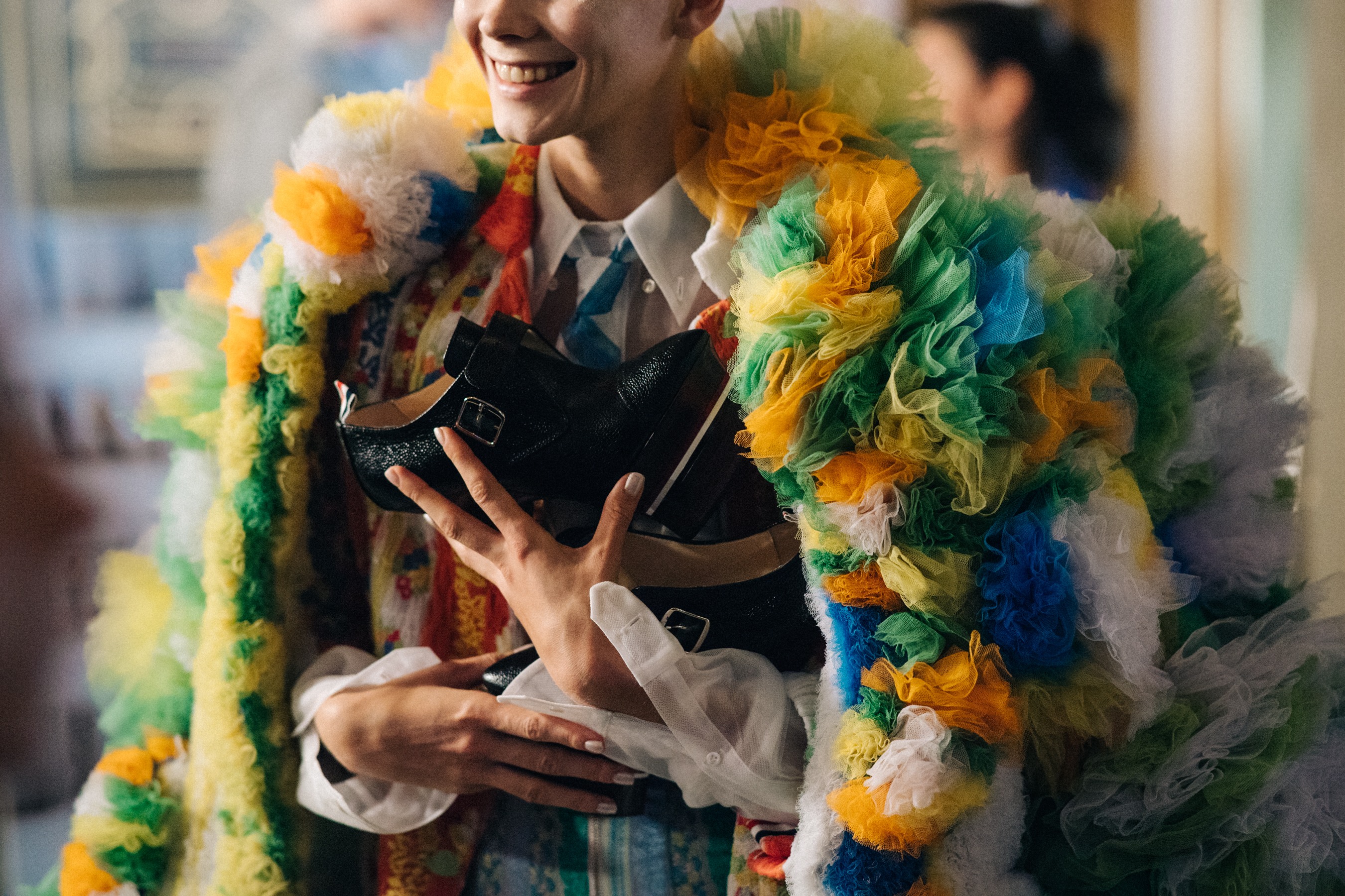Models wearing colourful reconstructed suits