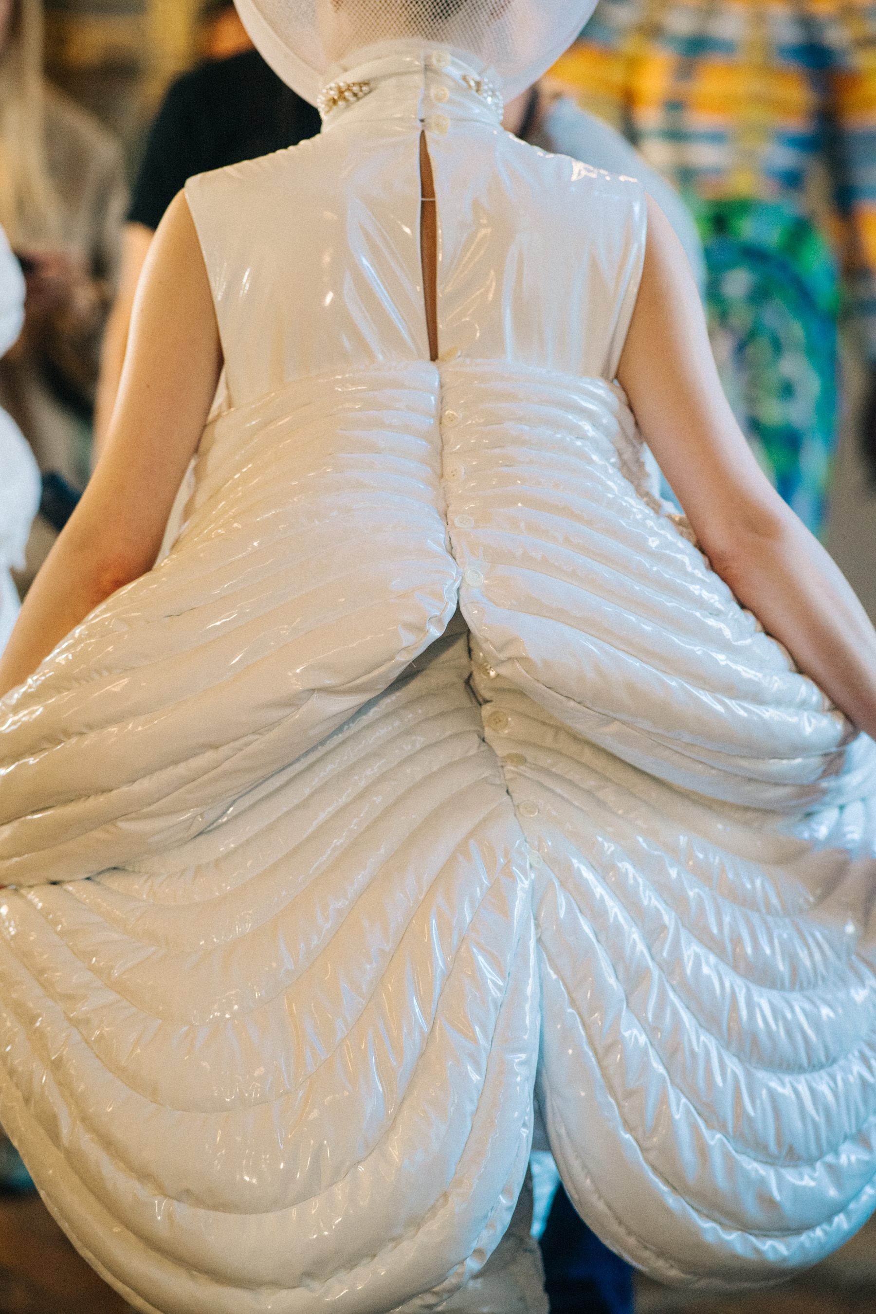 Model wearing white suit