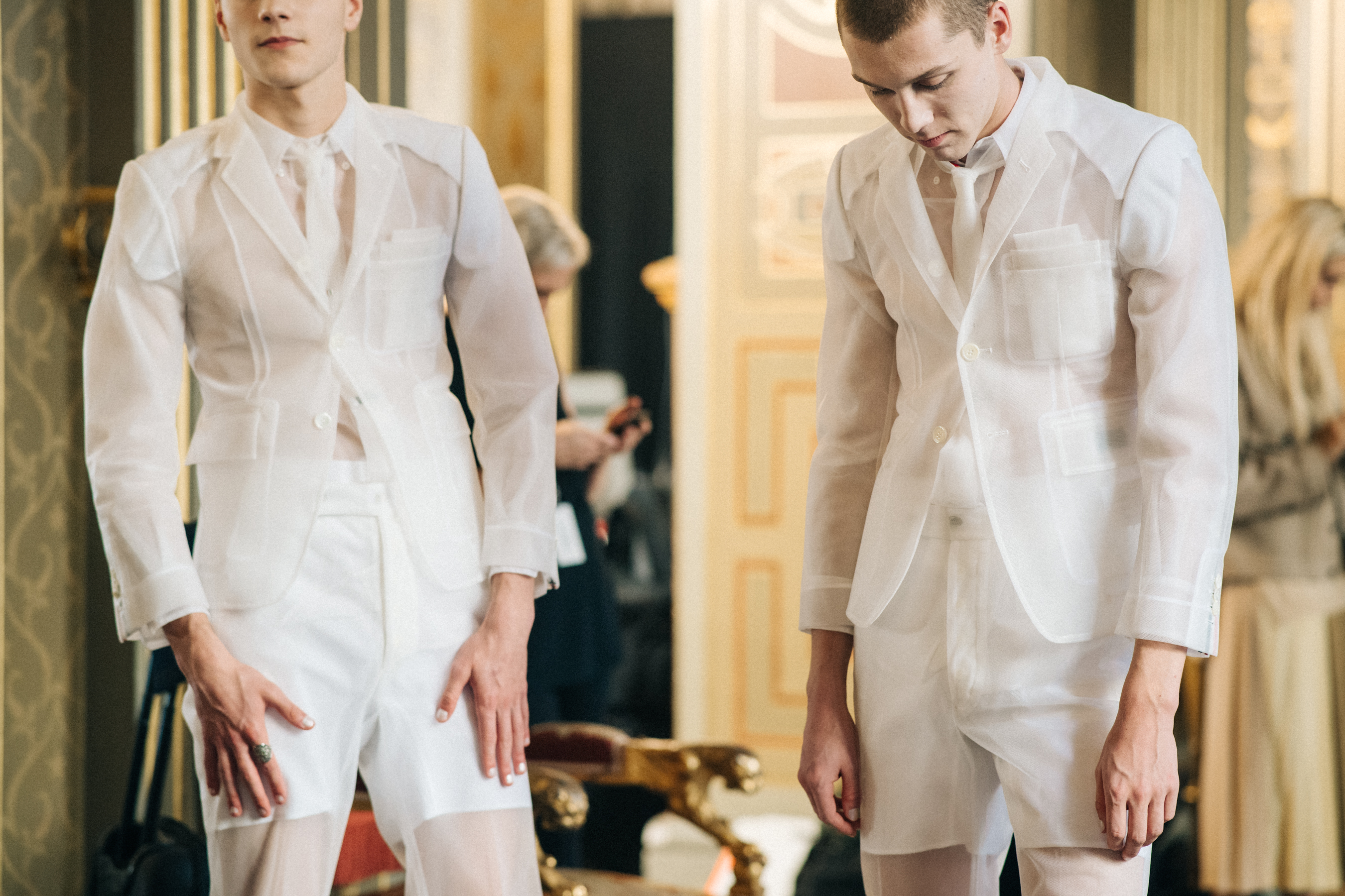 Model wearing white suit