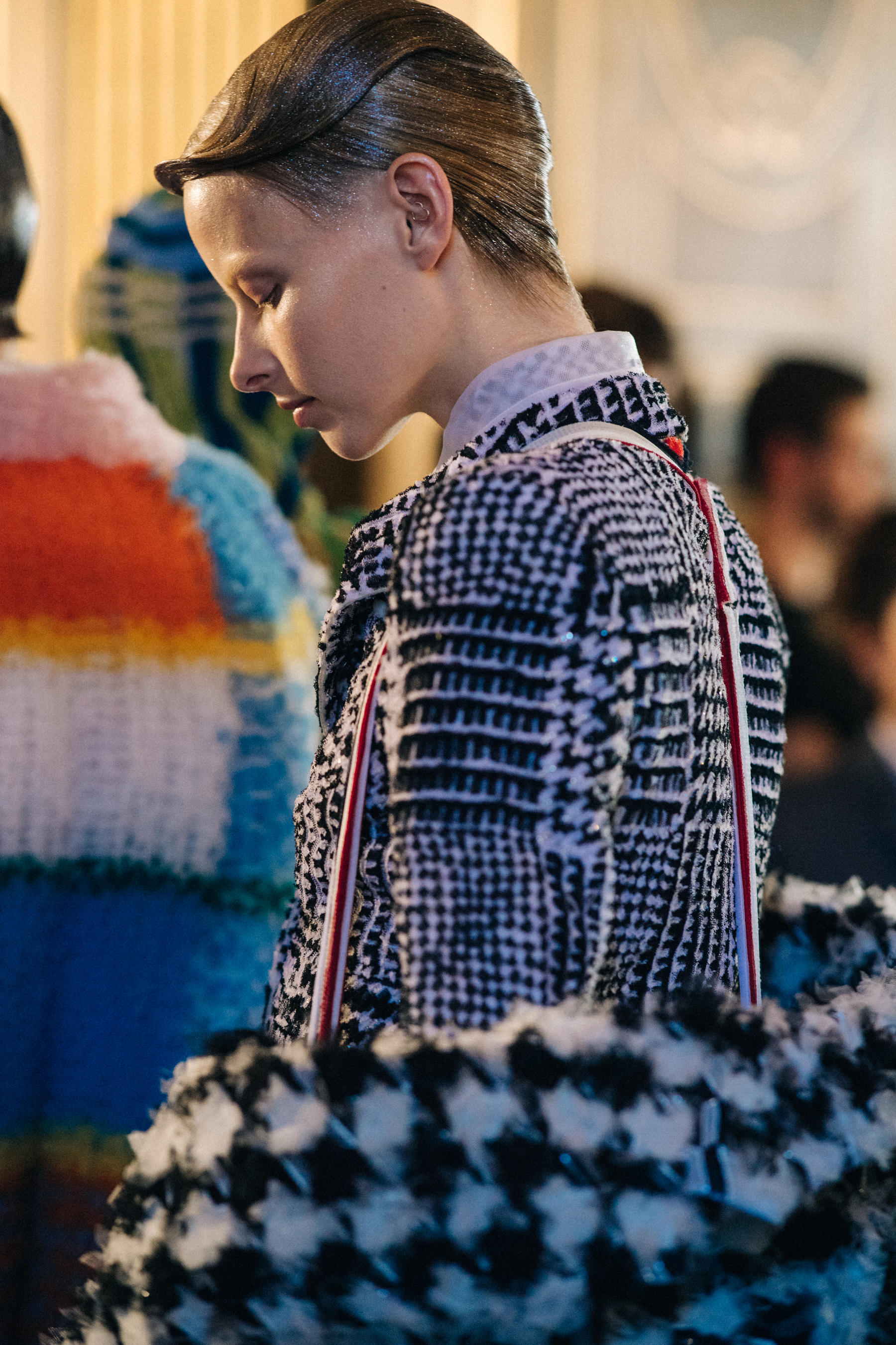 Models wearing colourful reconstructed suits