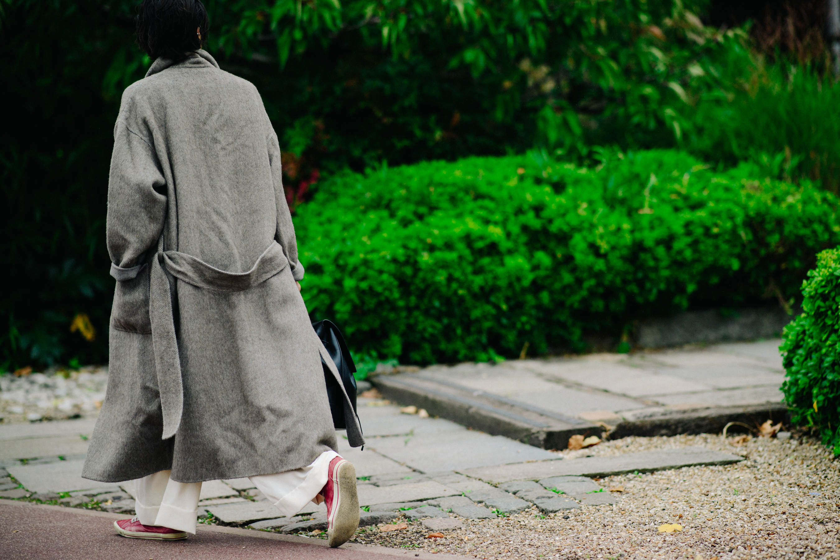 Man wearing long beige coat