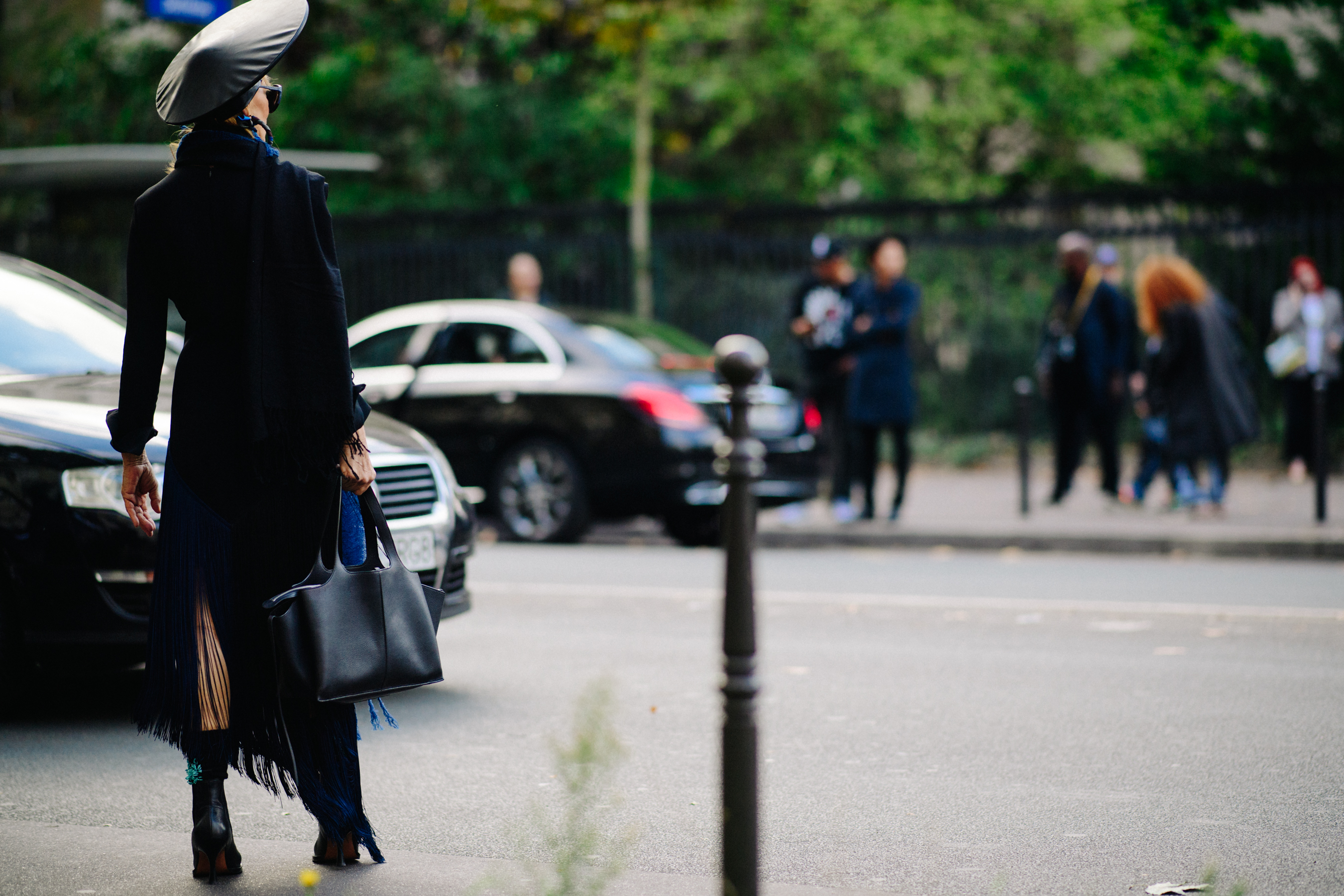 Woman wearing conceptual leather hat