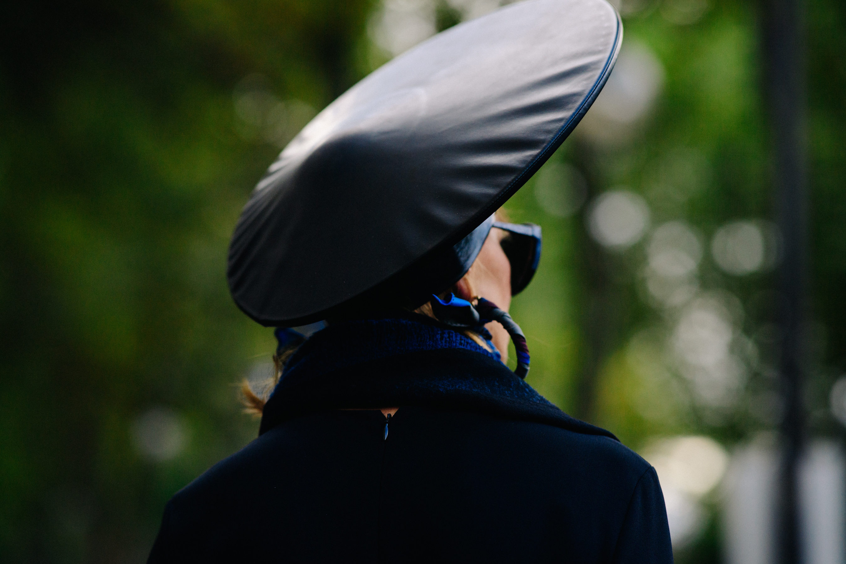 Woman wearing conceptual leather hat