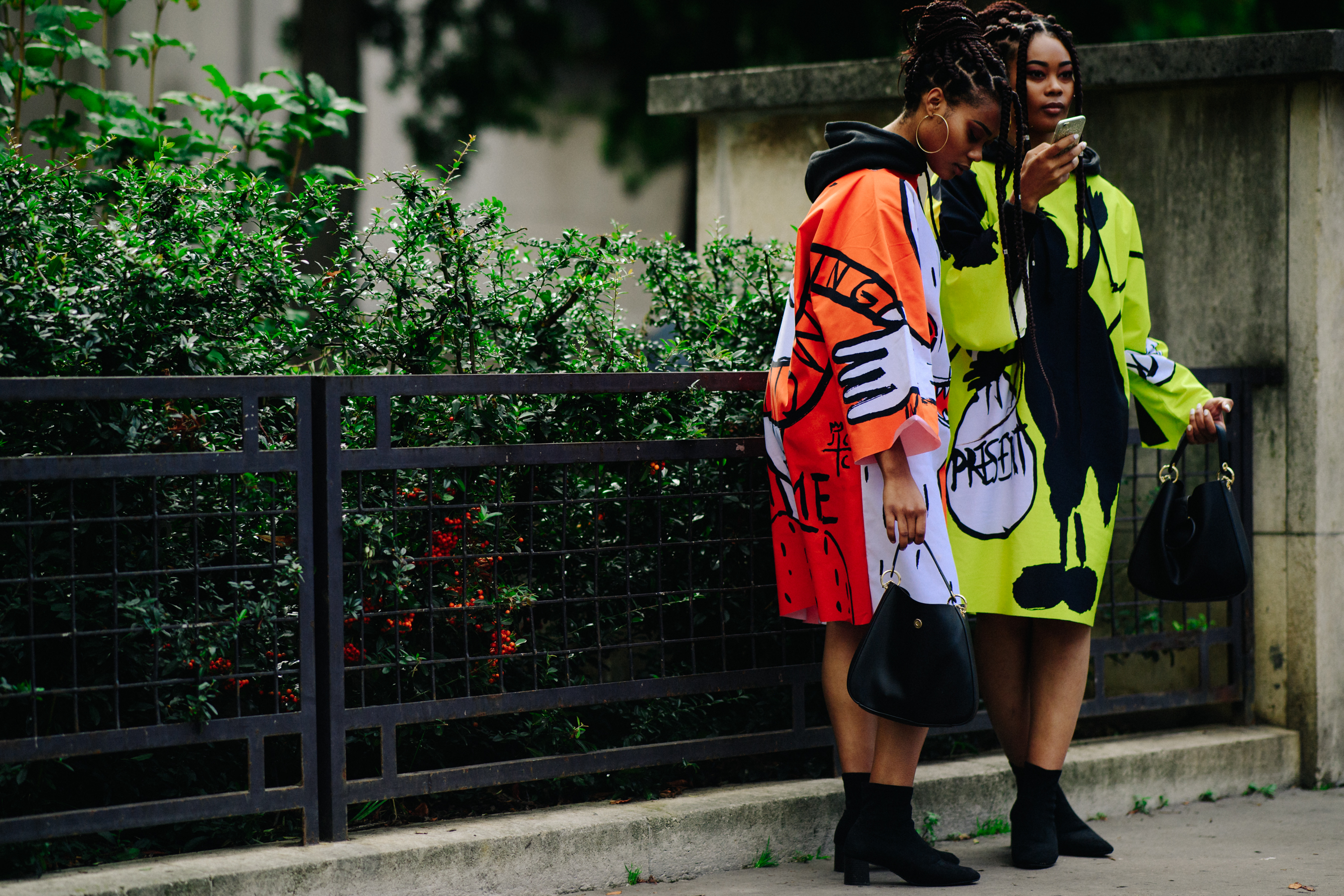 Two women wearing colourful outfits