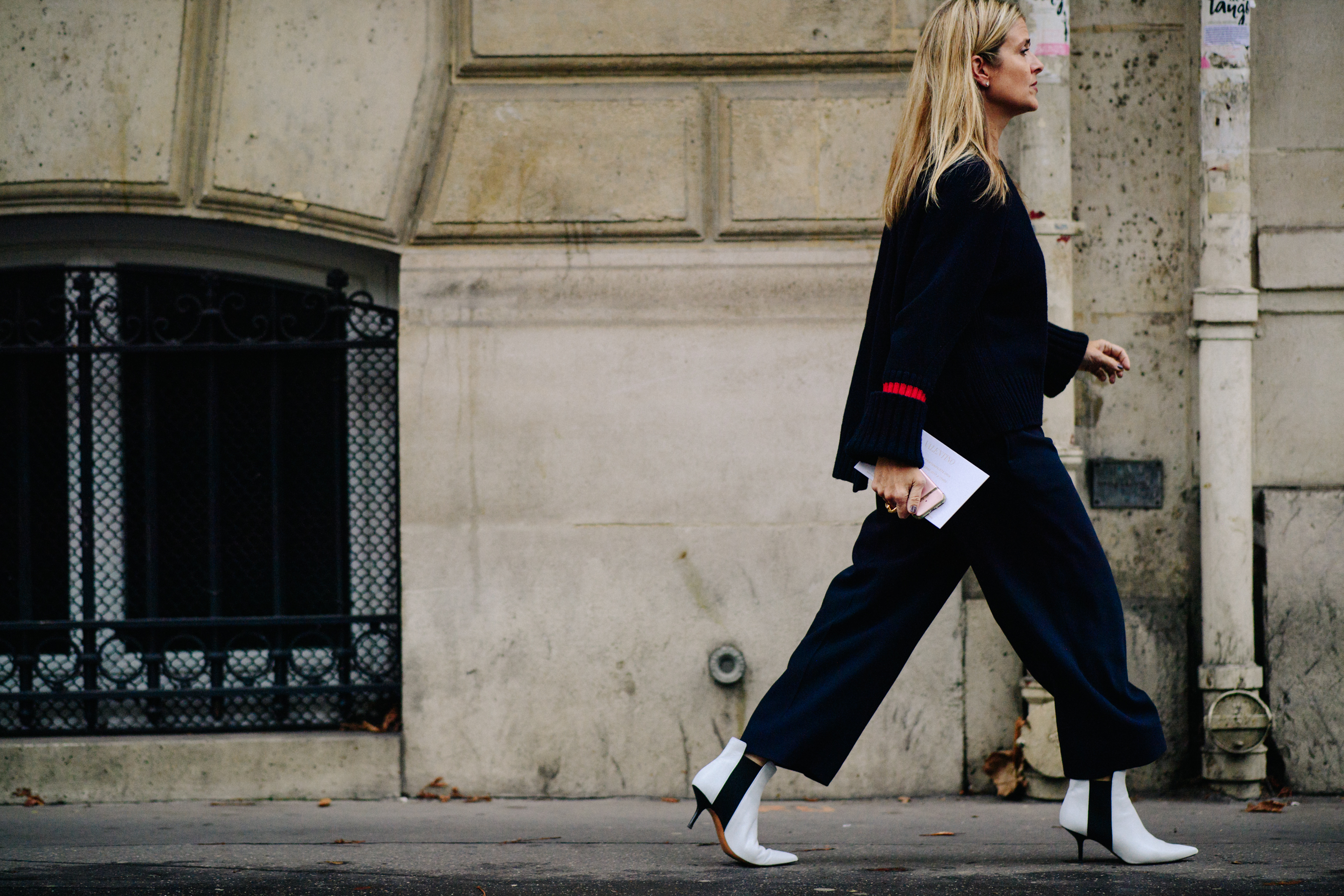 Woman wearing white ankle boots