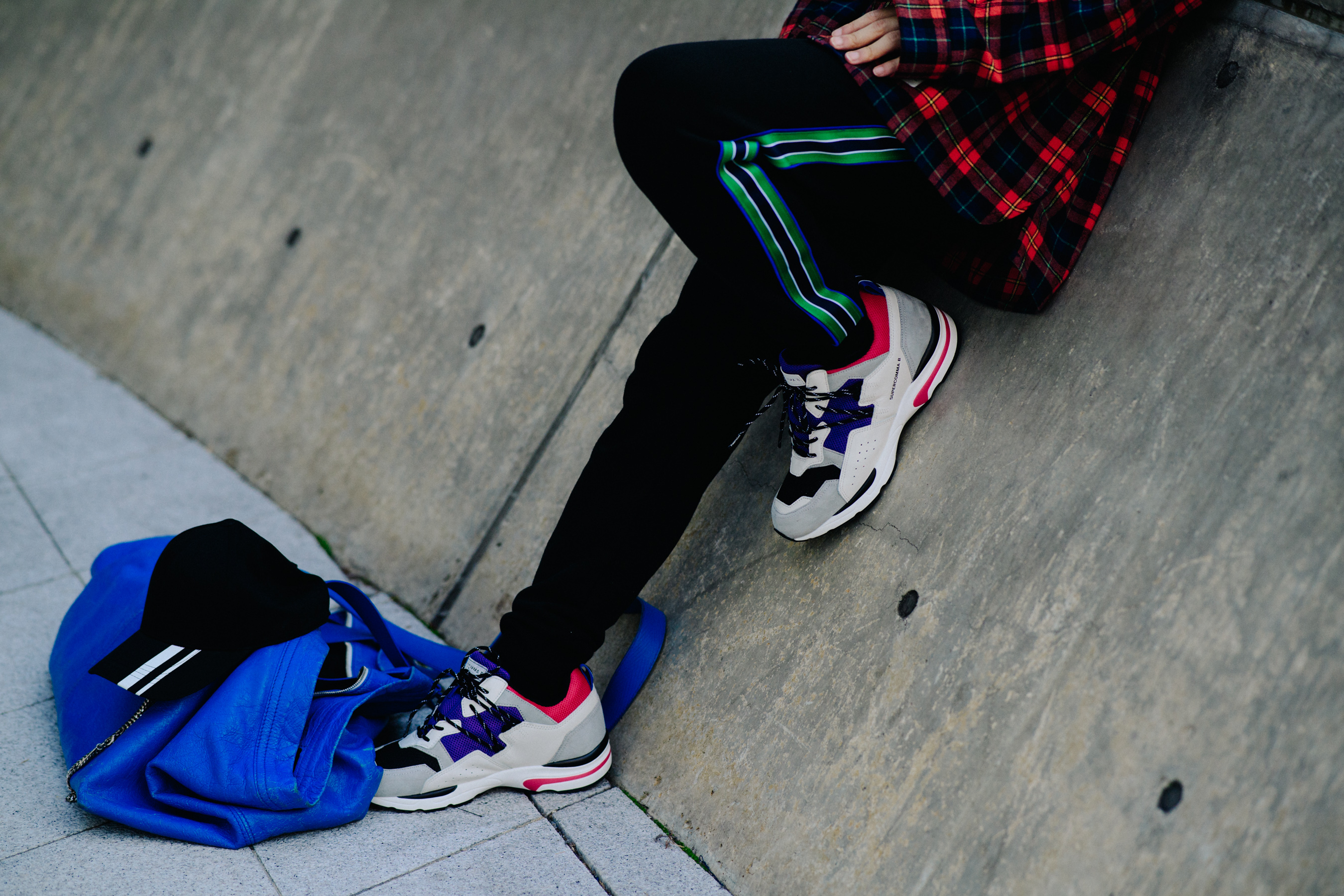 Closeup of man in coloulful chunky sneakers