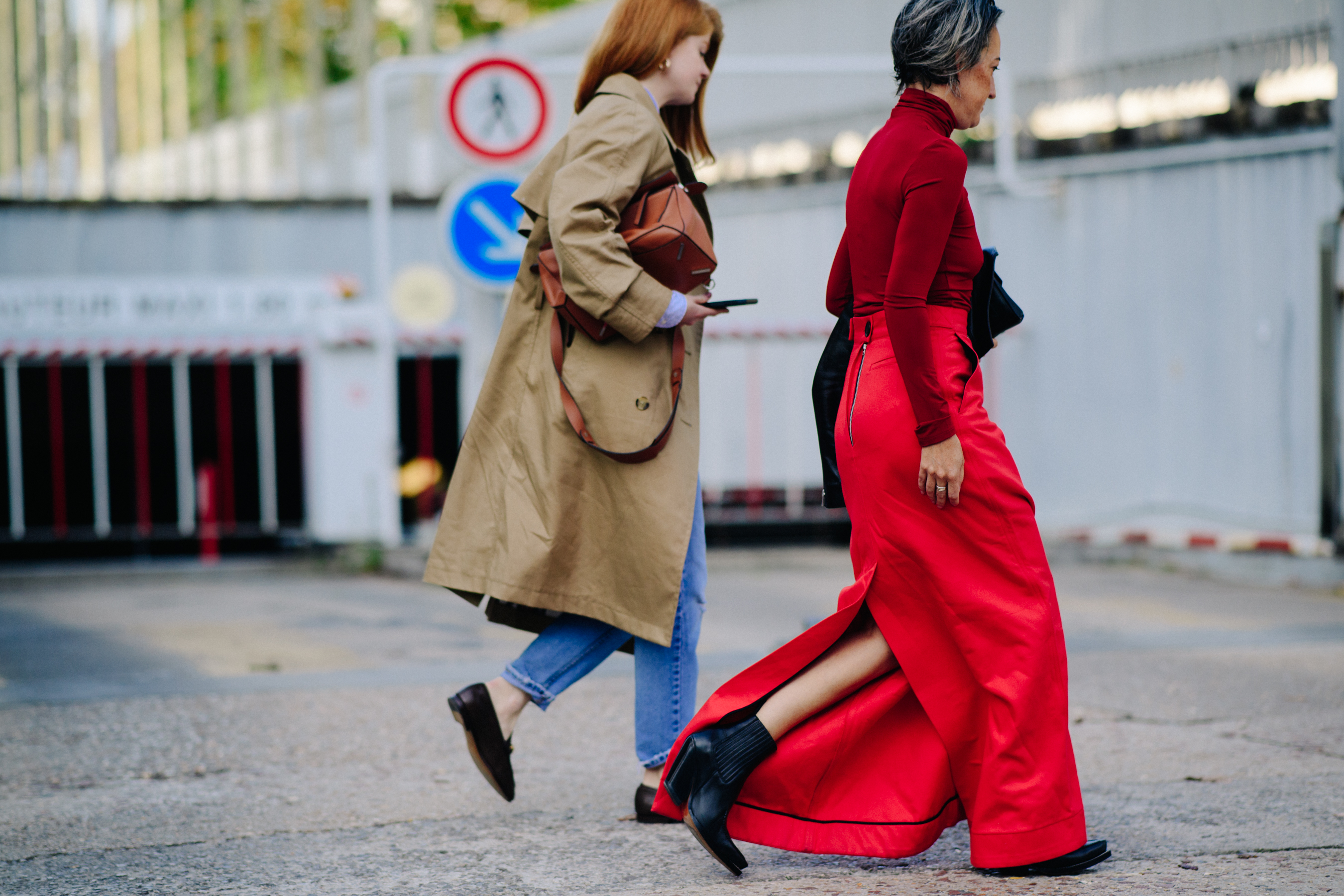Two women wearing red and beige