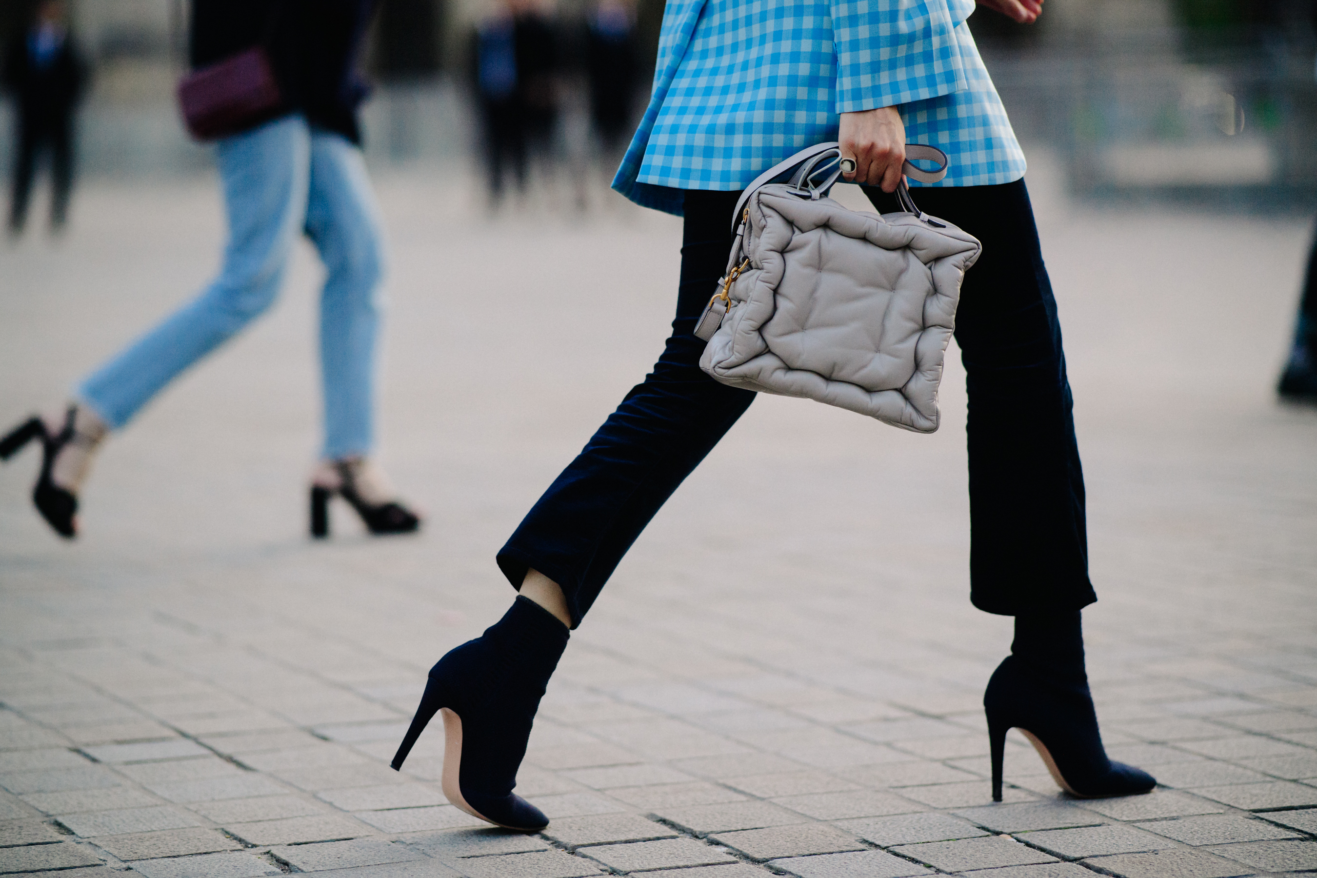 Woman wearing black stiletto shoes