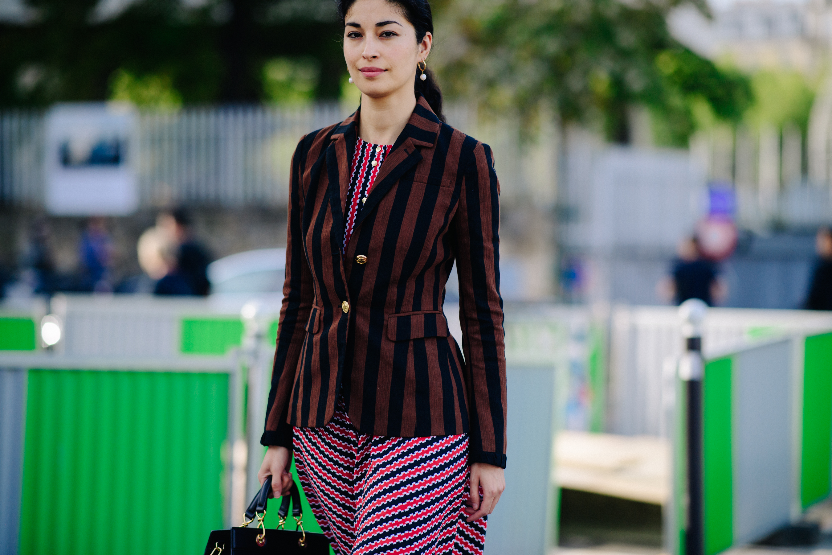 Editor wearing red printed dress