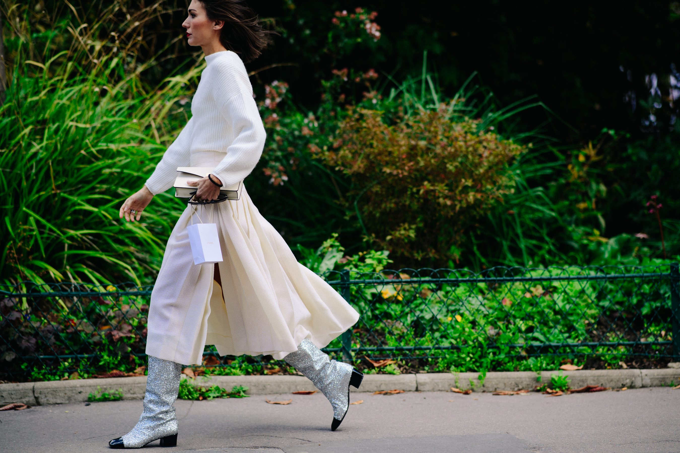Italian woman wearing Chanel silver boots