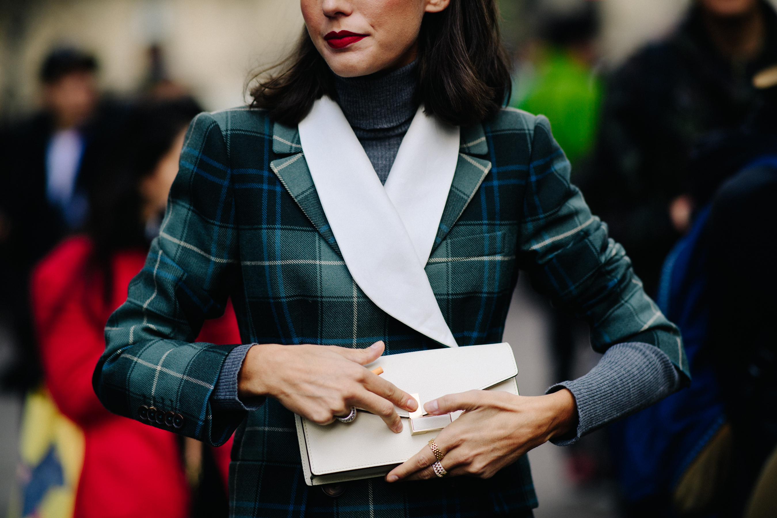 Italian stylist wearing green coat