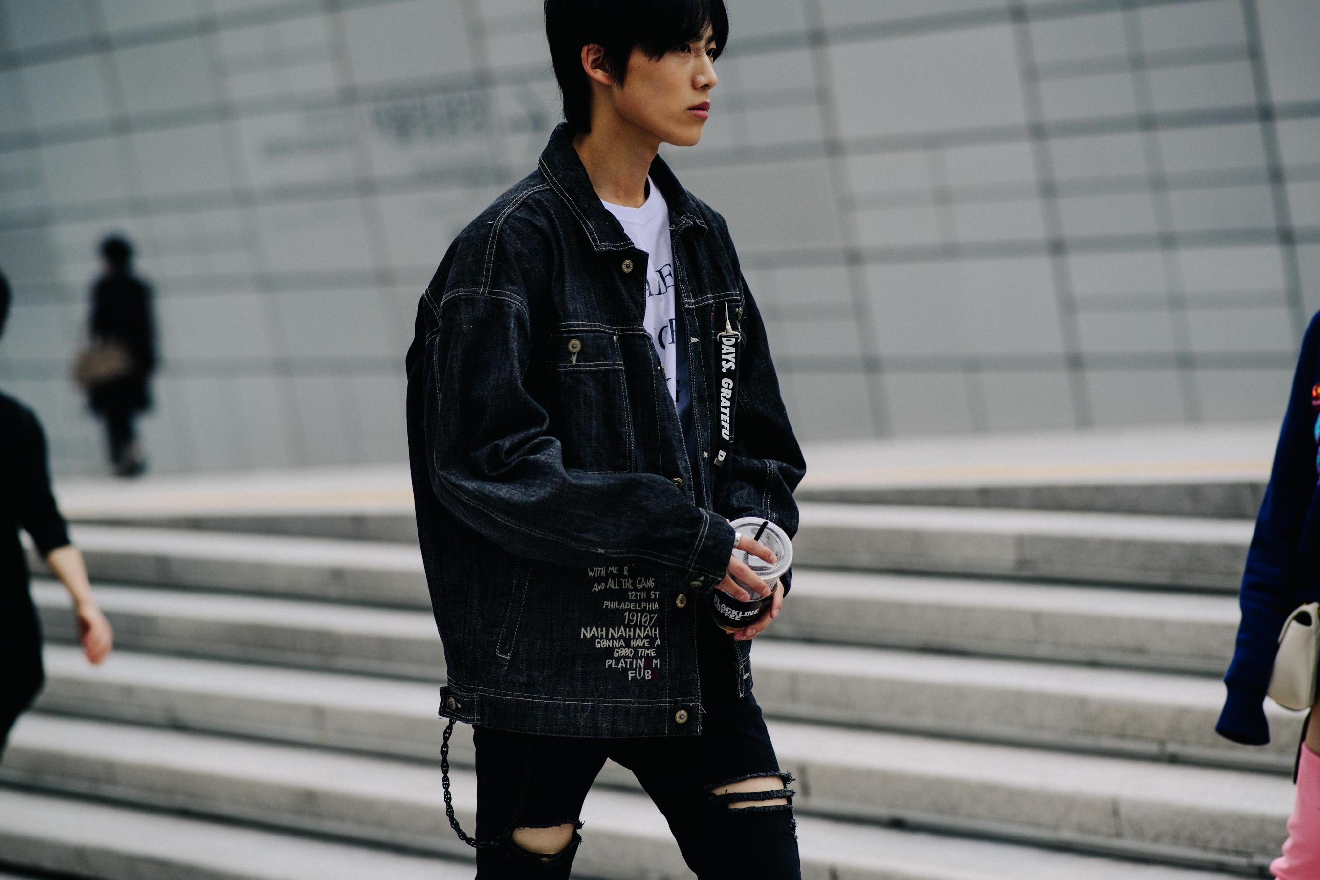 Man wearing dark denim outfit