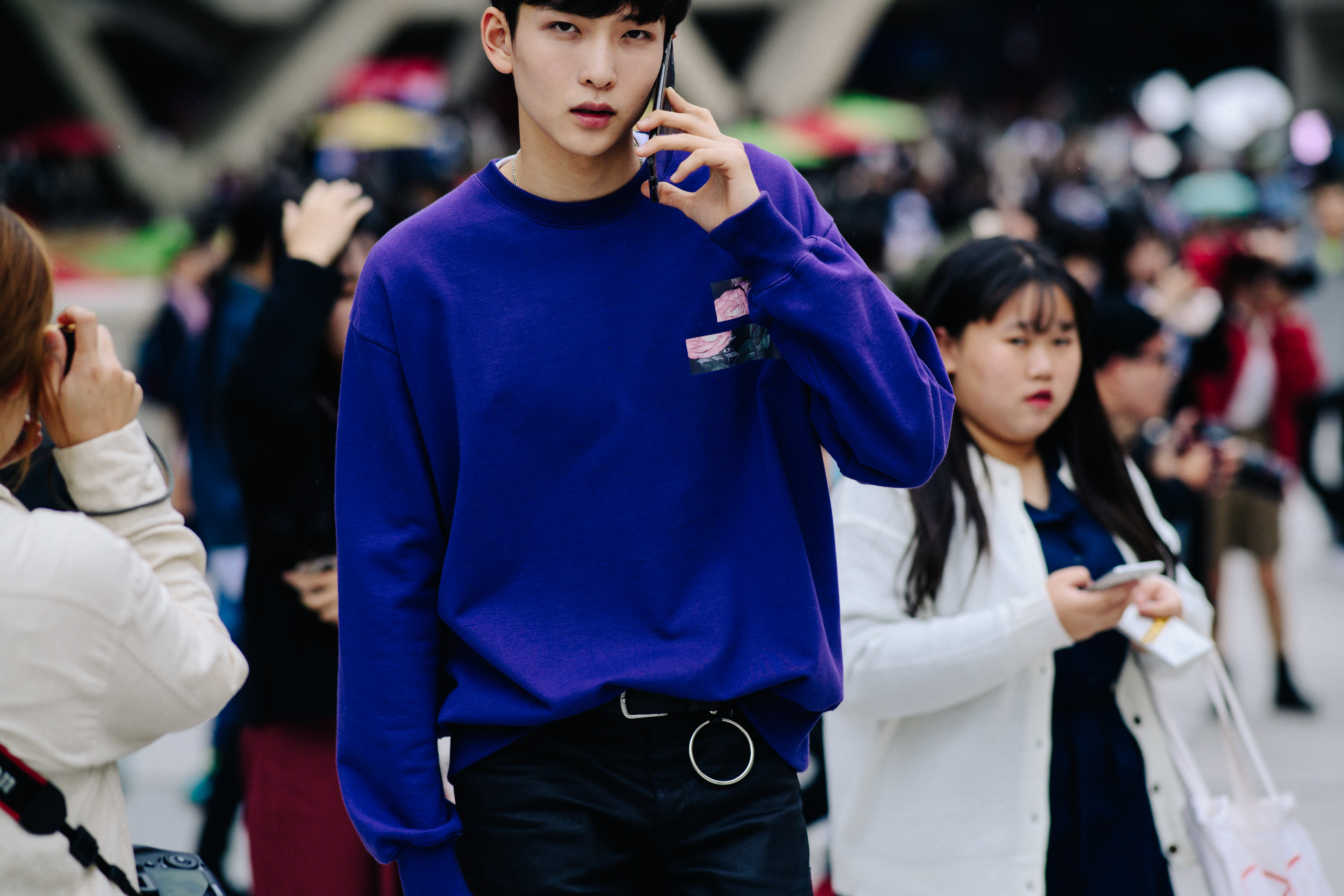 Crop of model wearing bright blue purple jumper