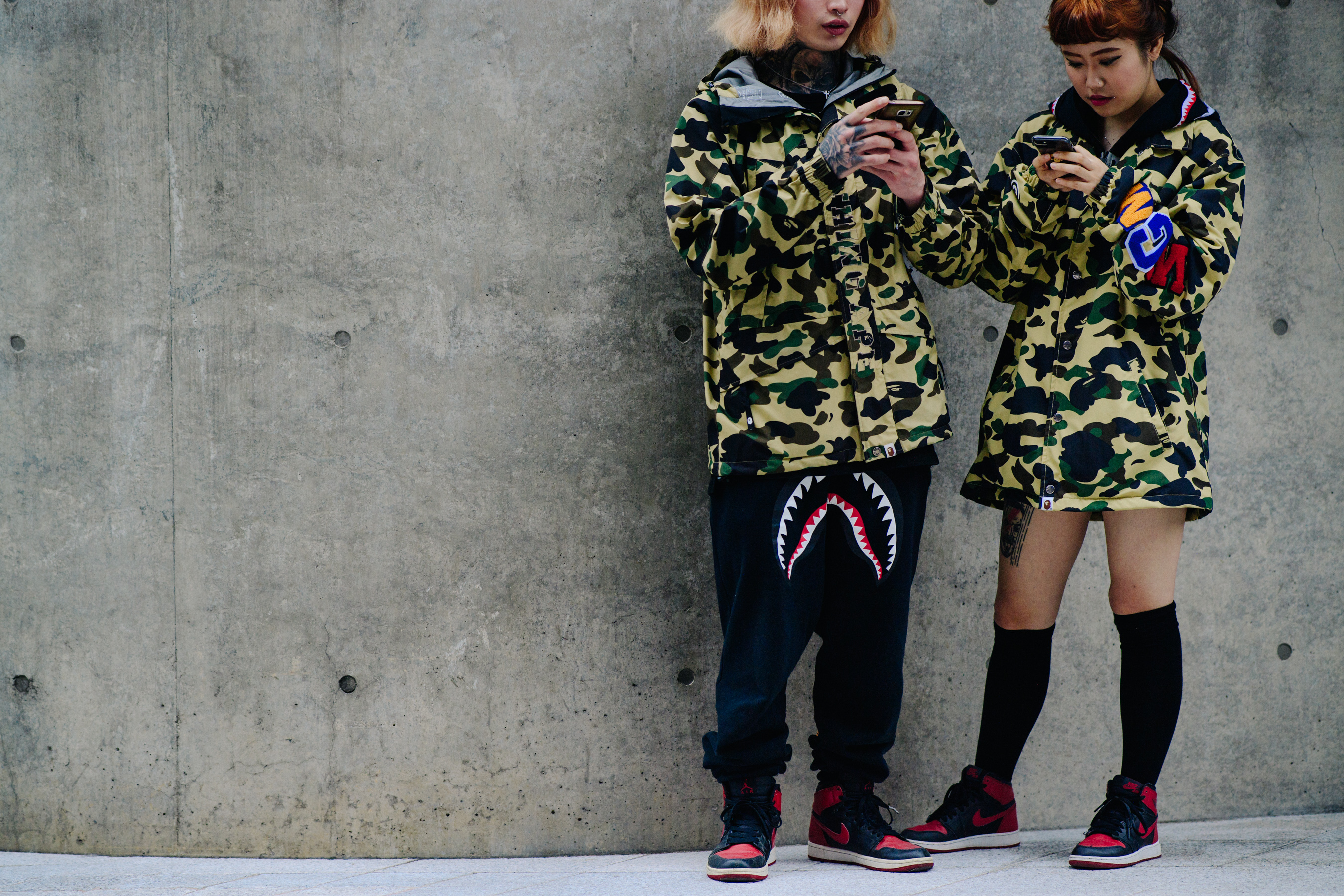 Couple waering matching A Bathing Ape coats