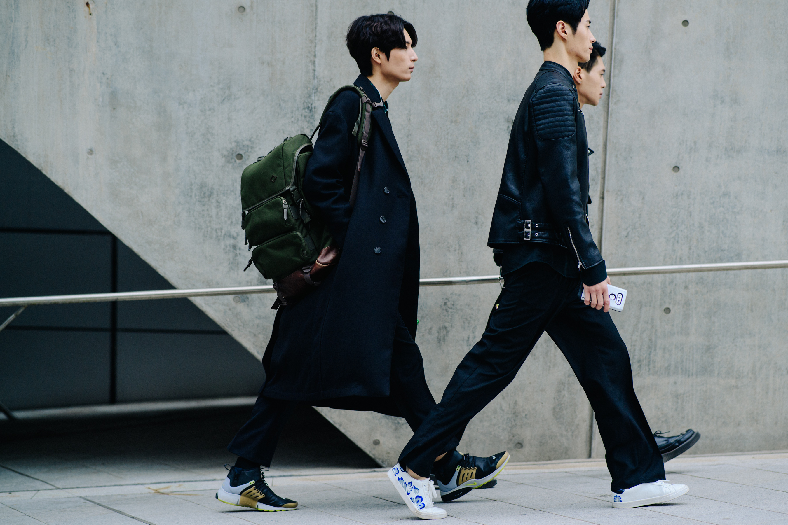 Three men in black outfits