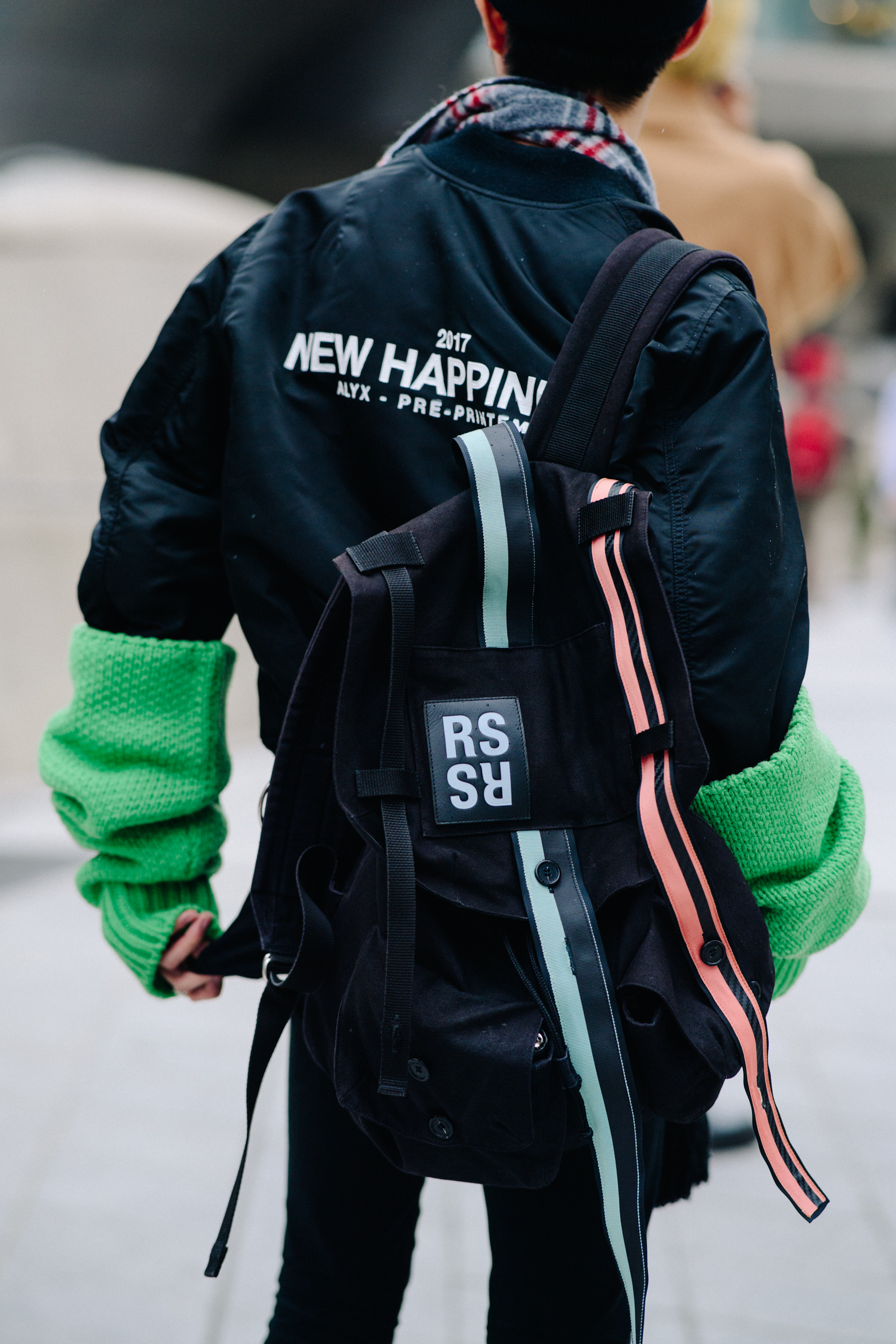 Back of man in Alyx bomber jacket
